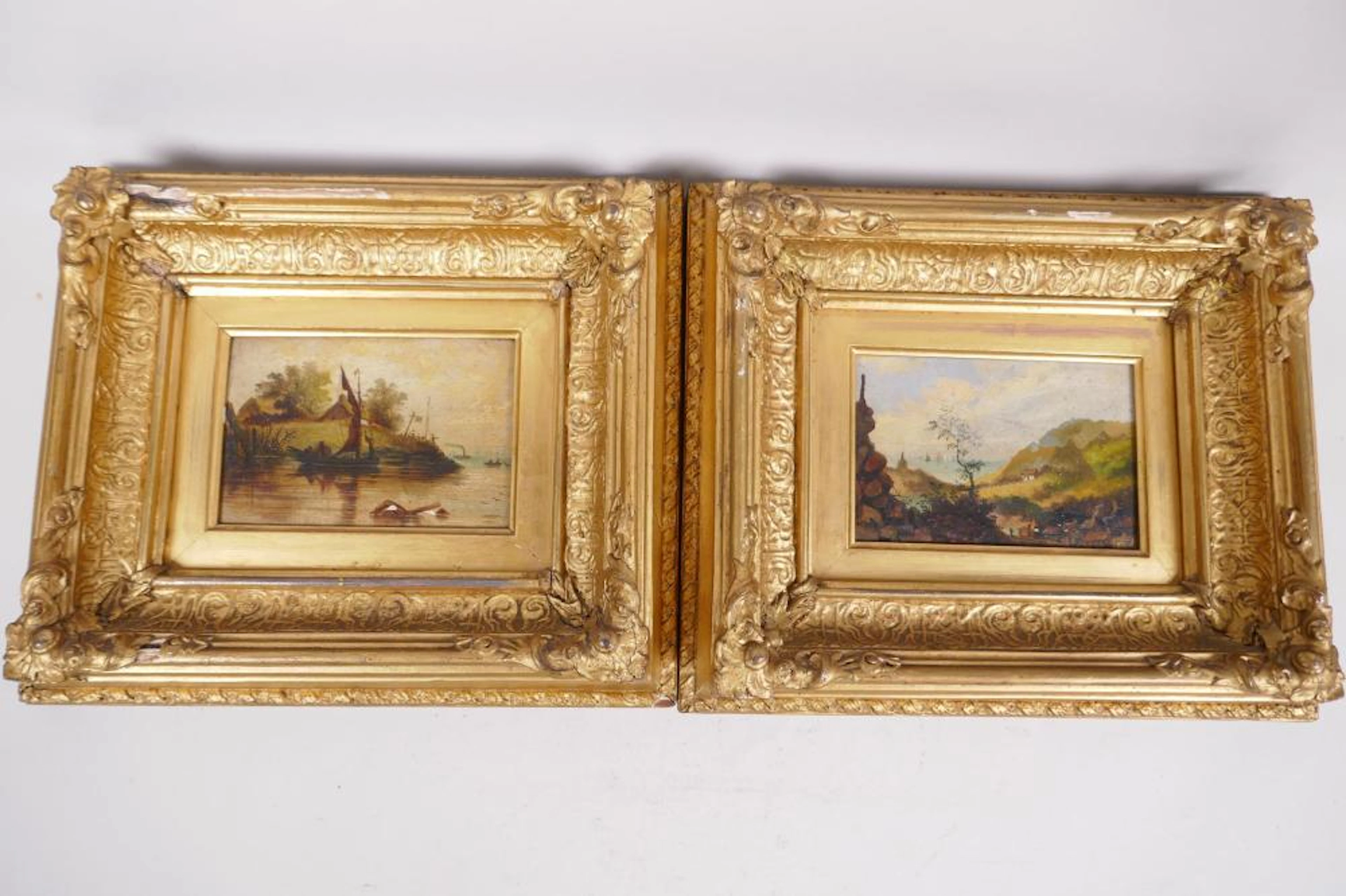 A pair of gilt framed oils on panel