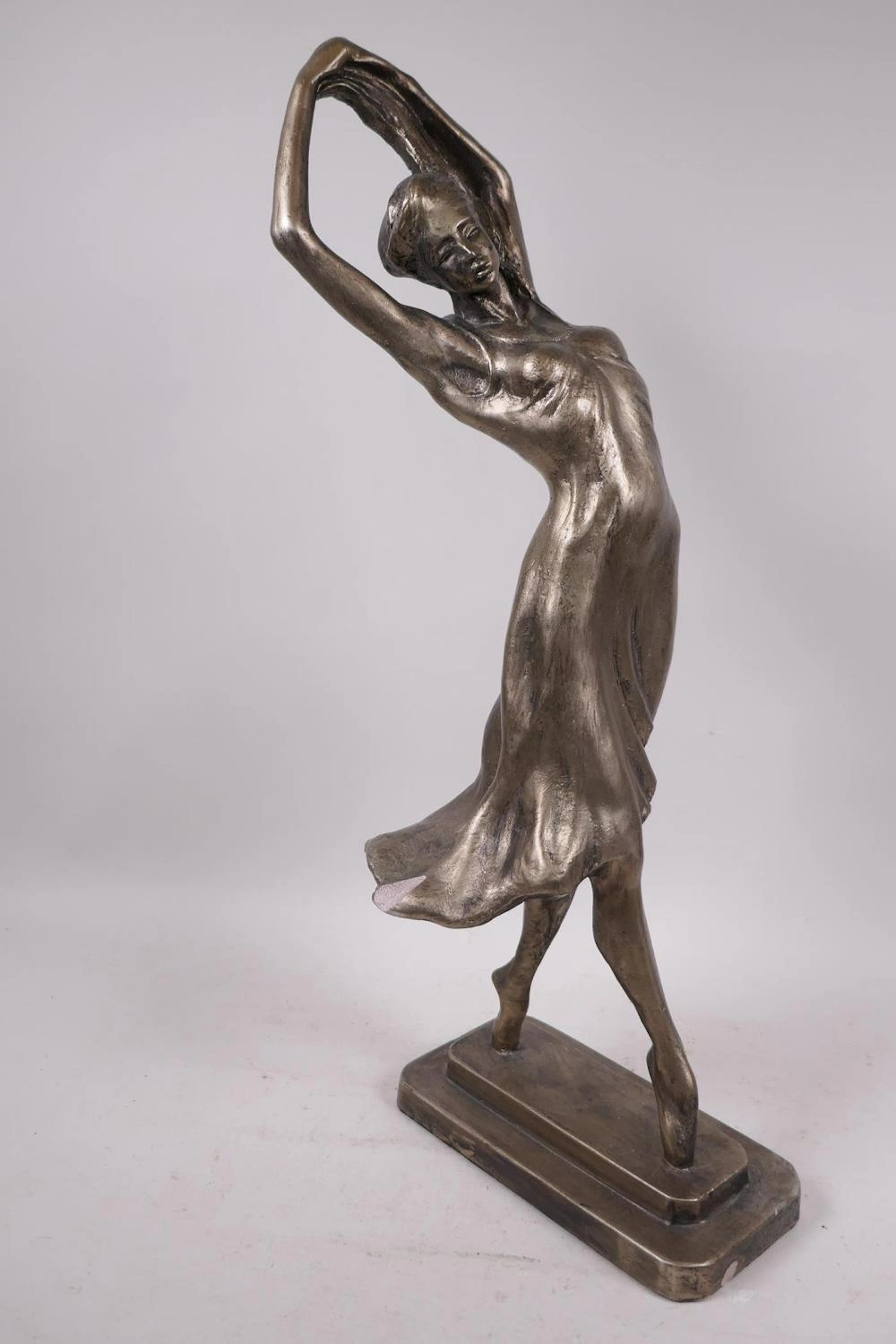 An Austin Products composition figure of a dancing girl, signed Muci, 20" high