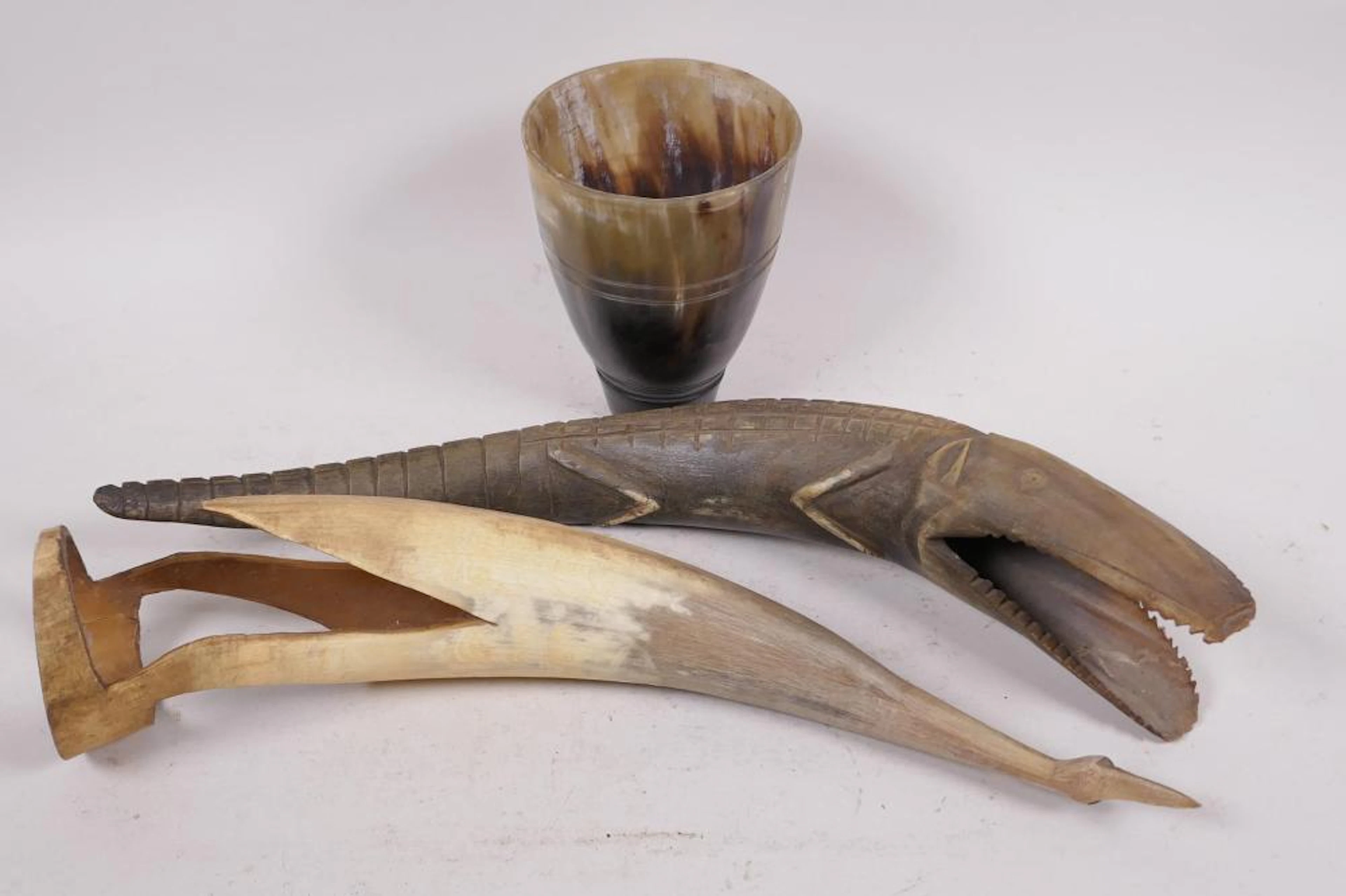 An Ethiopian carved horn beaker