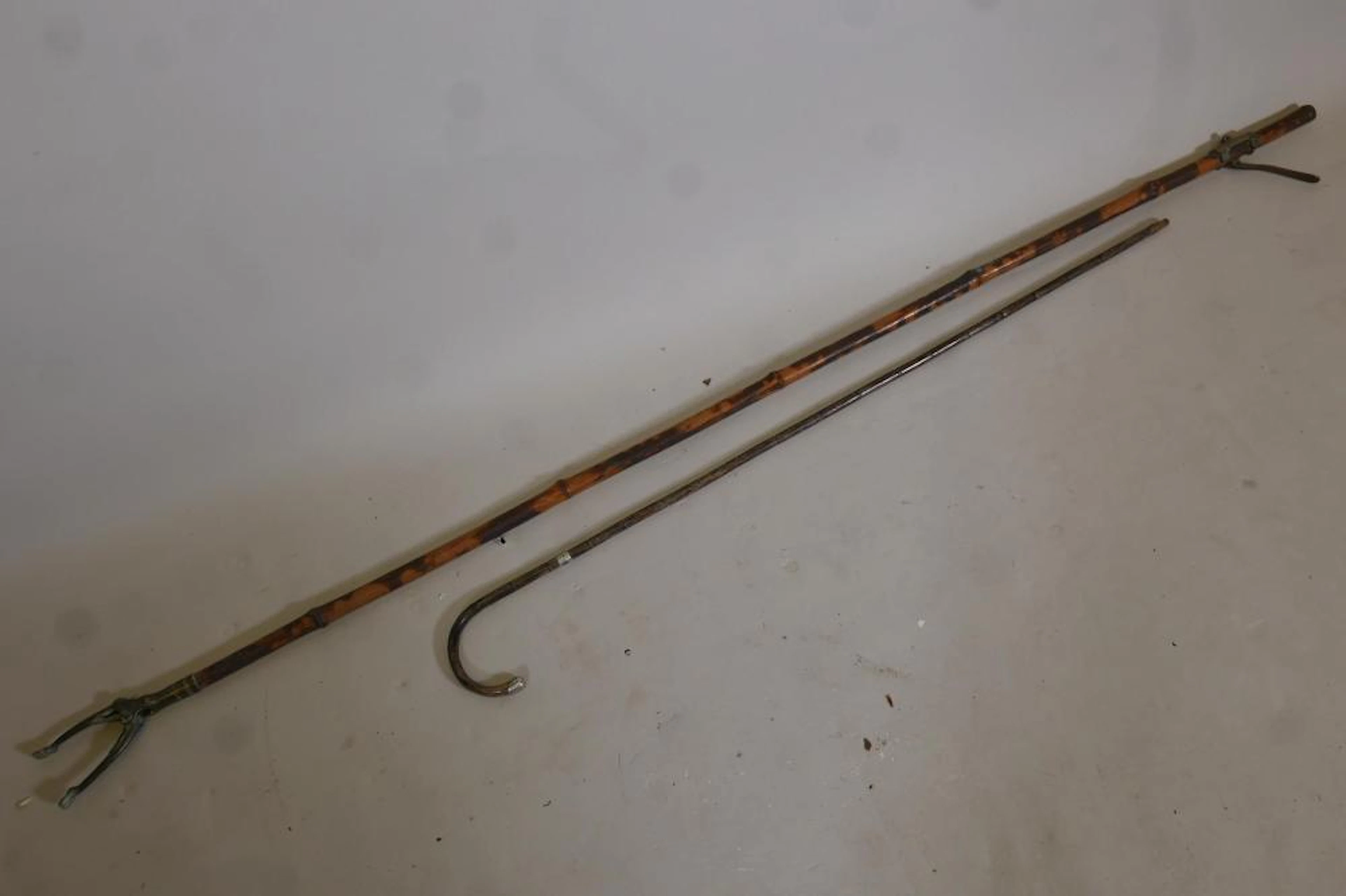 An oriental silver mounted bamboo walking cane