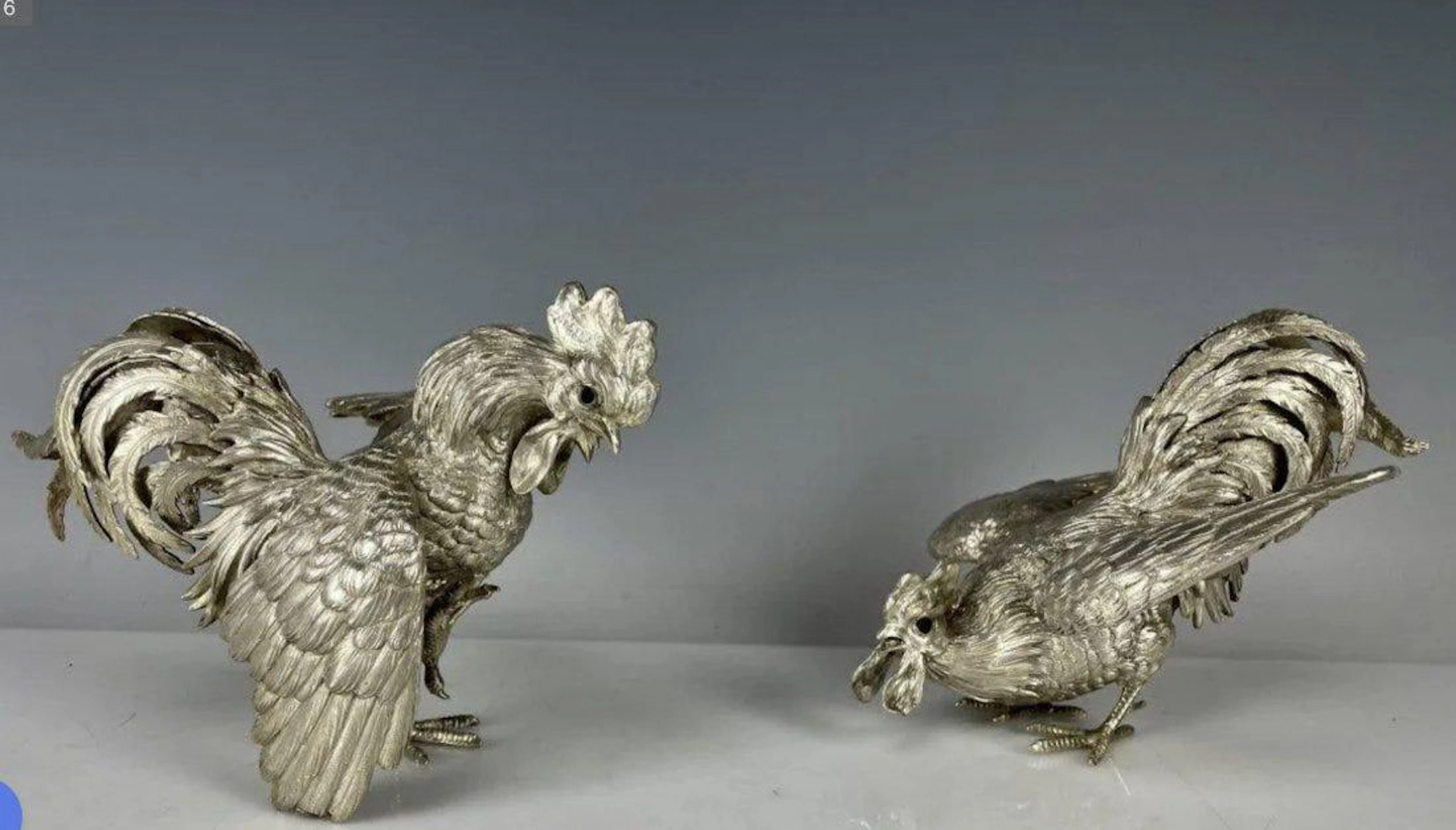 A PAIR OF STERLING SILVER FIGHTING COCKS