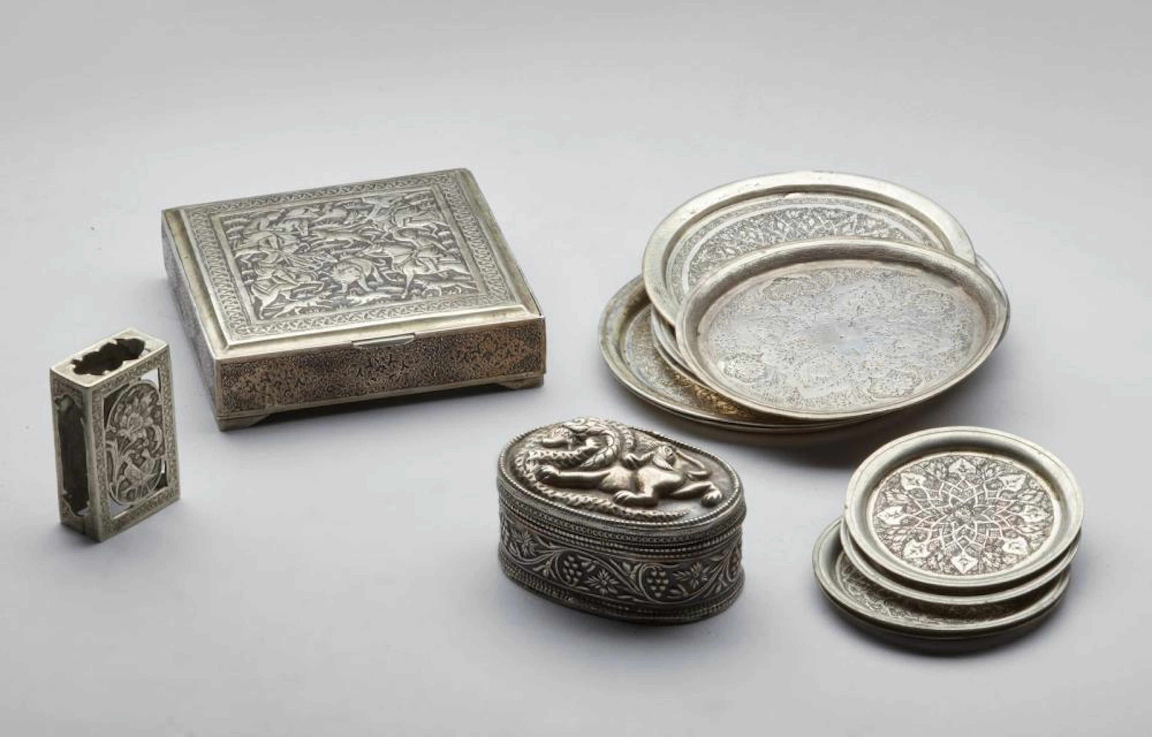 Islamic Art A collection of 13 Persian silver and silver...