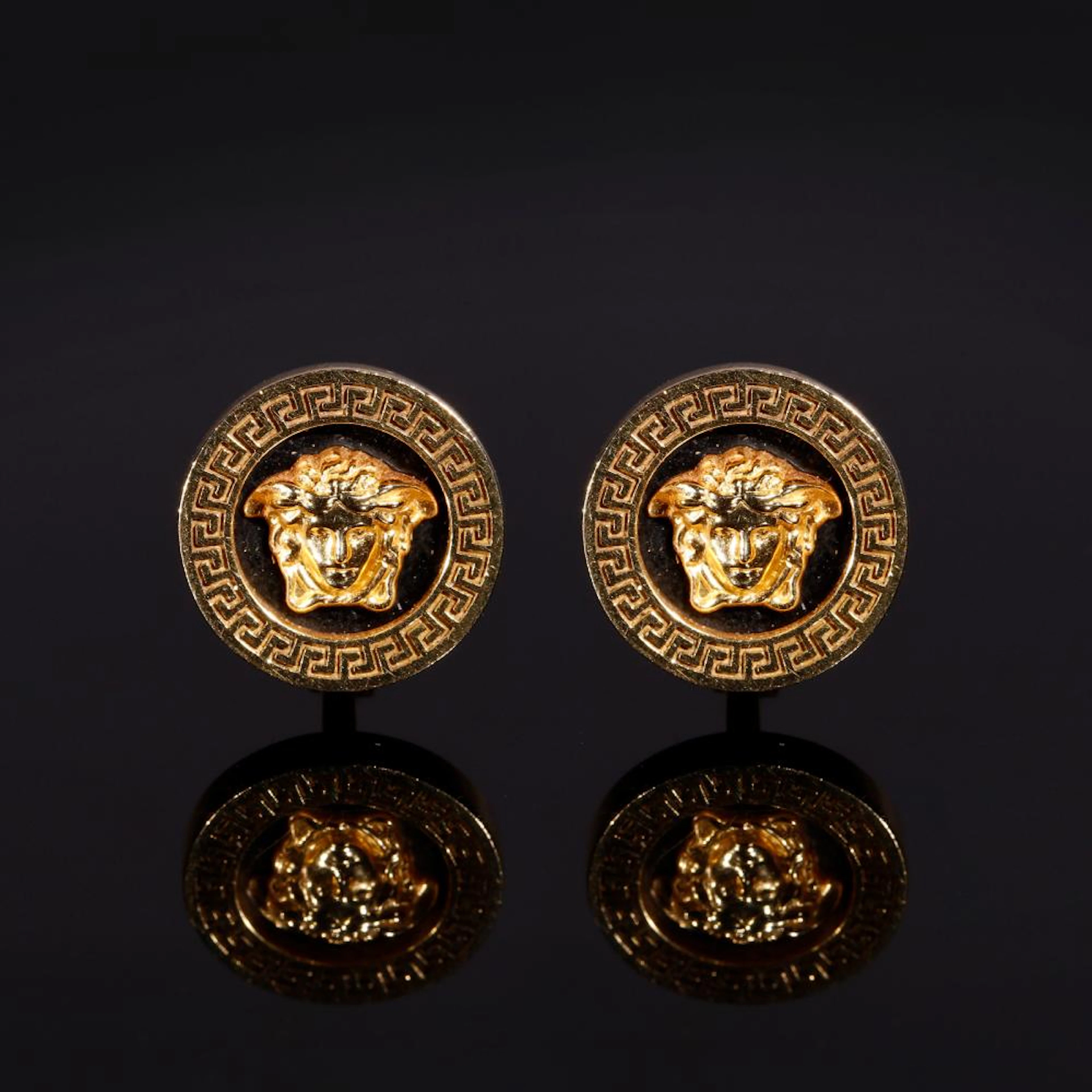 VERSACE GIANNI (1946 - 1997) A pair of 18 kt yellow gold Medusa button earrings.