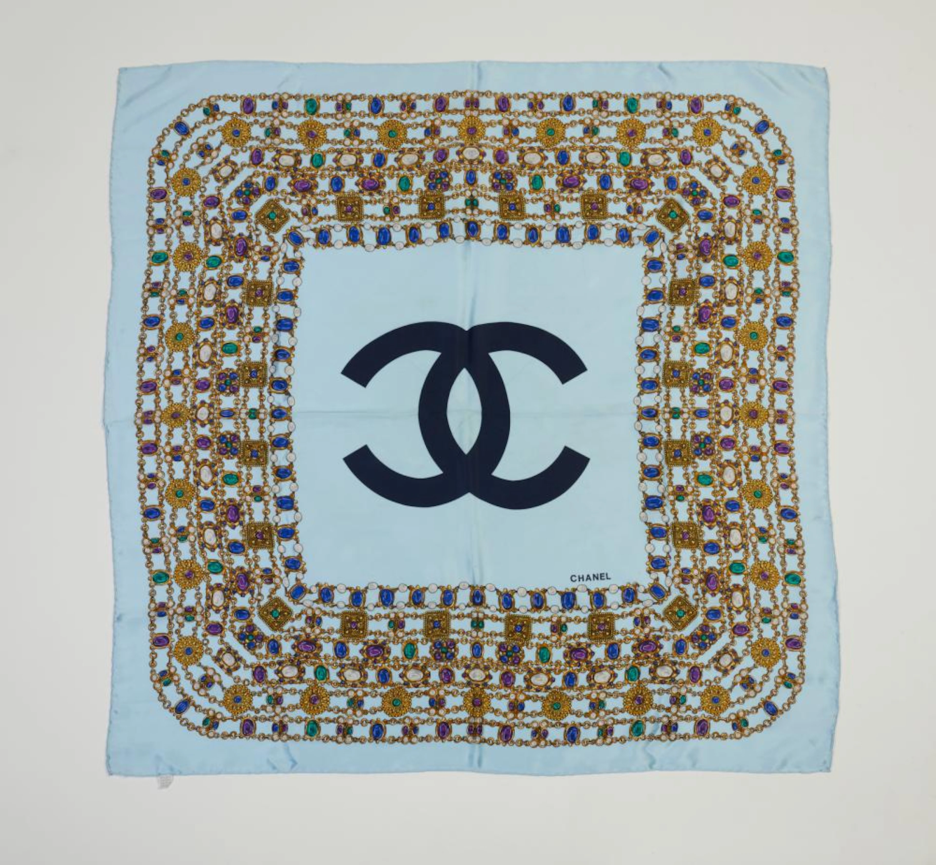 CHANEL - Patterned light blue silk scarf.