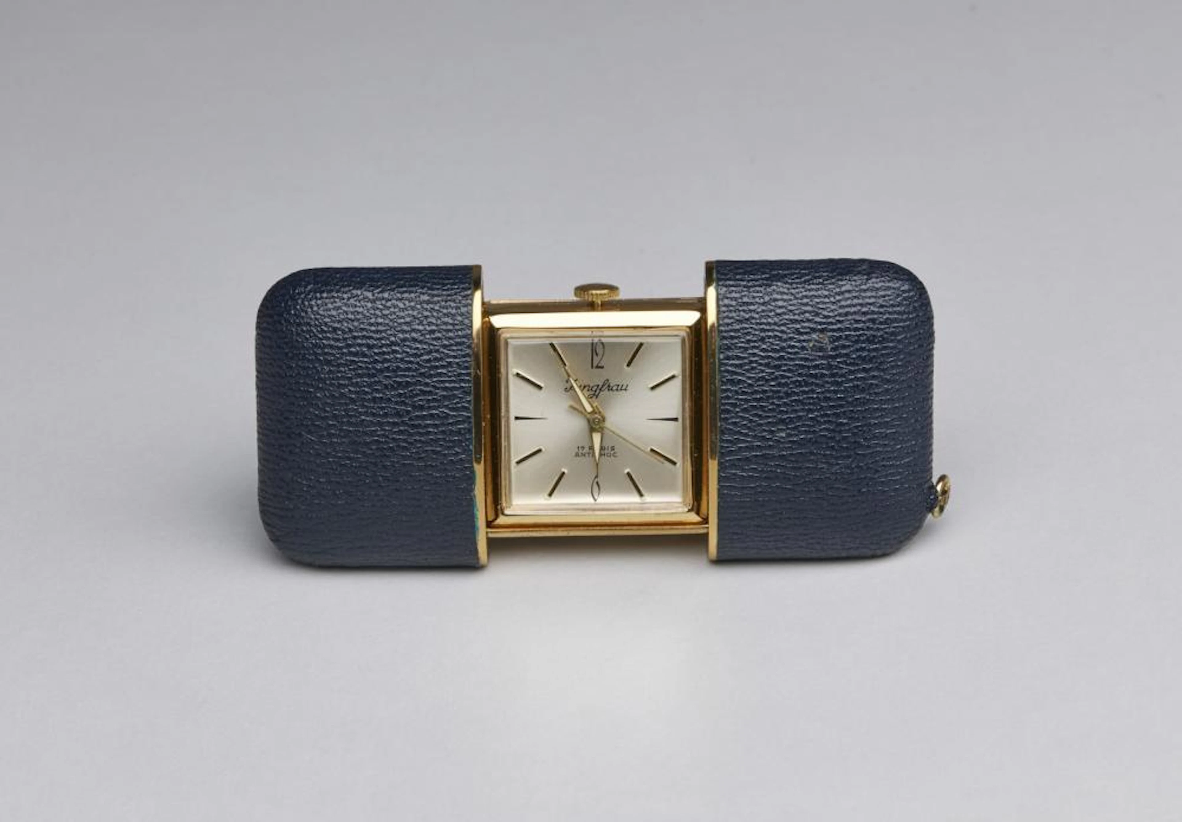 Piccolo orologio da viaggio da tasca con astuccio rigido in pele blu