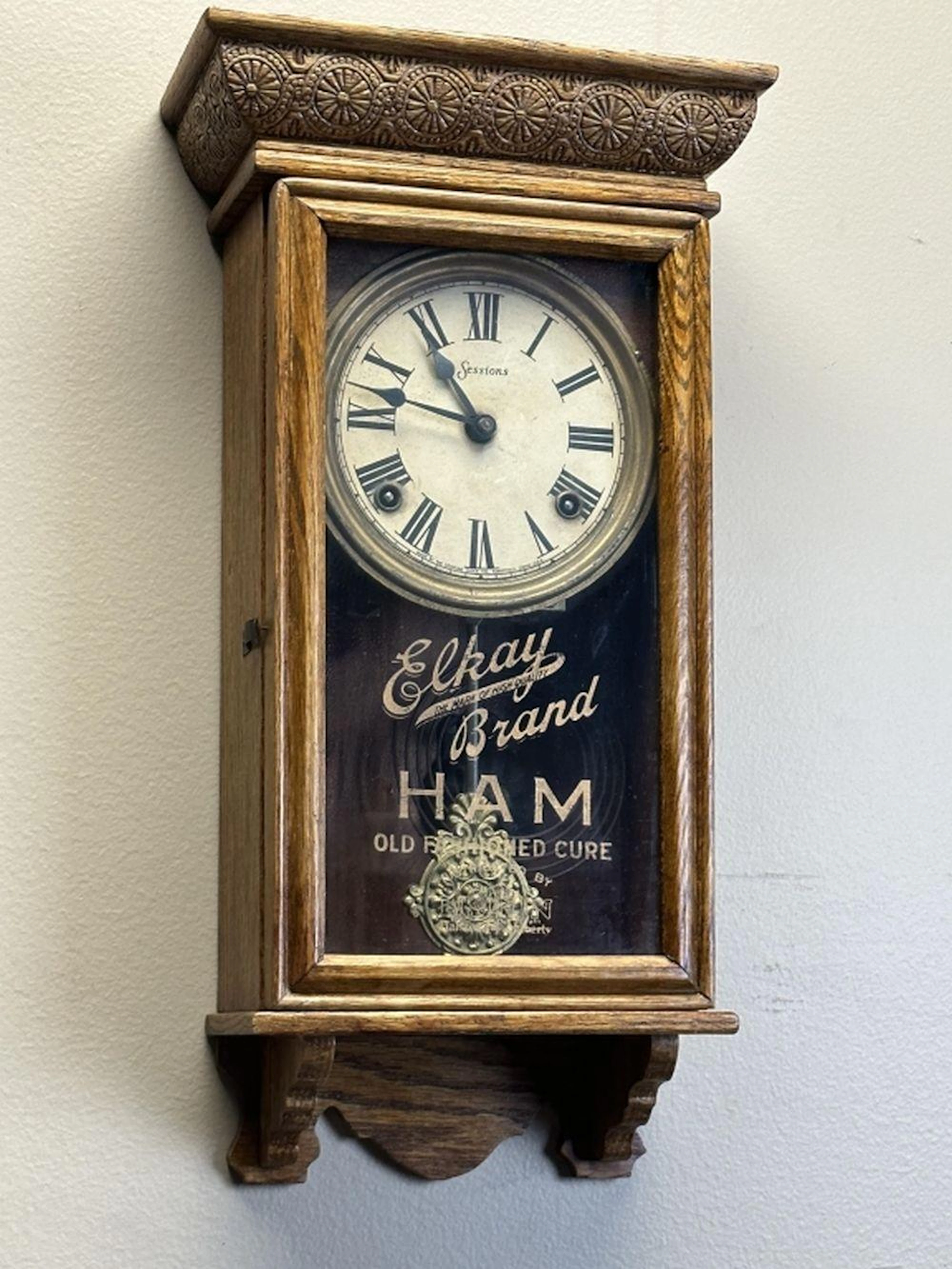 Antique Sessions Wall Clock Advertisement on Case