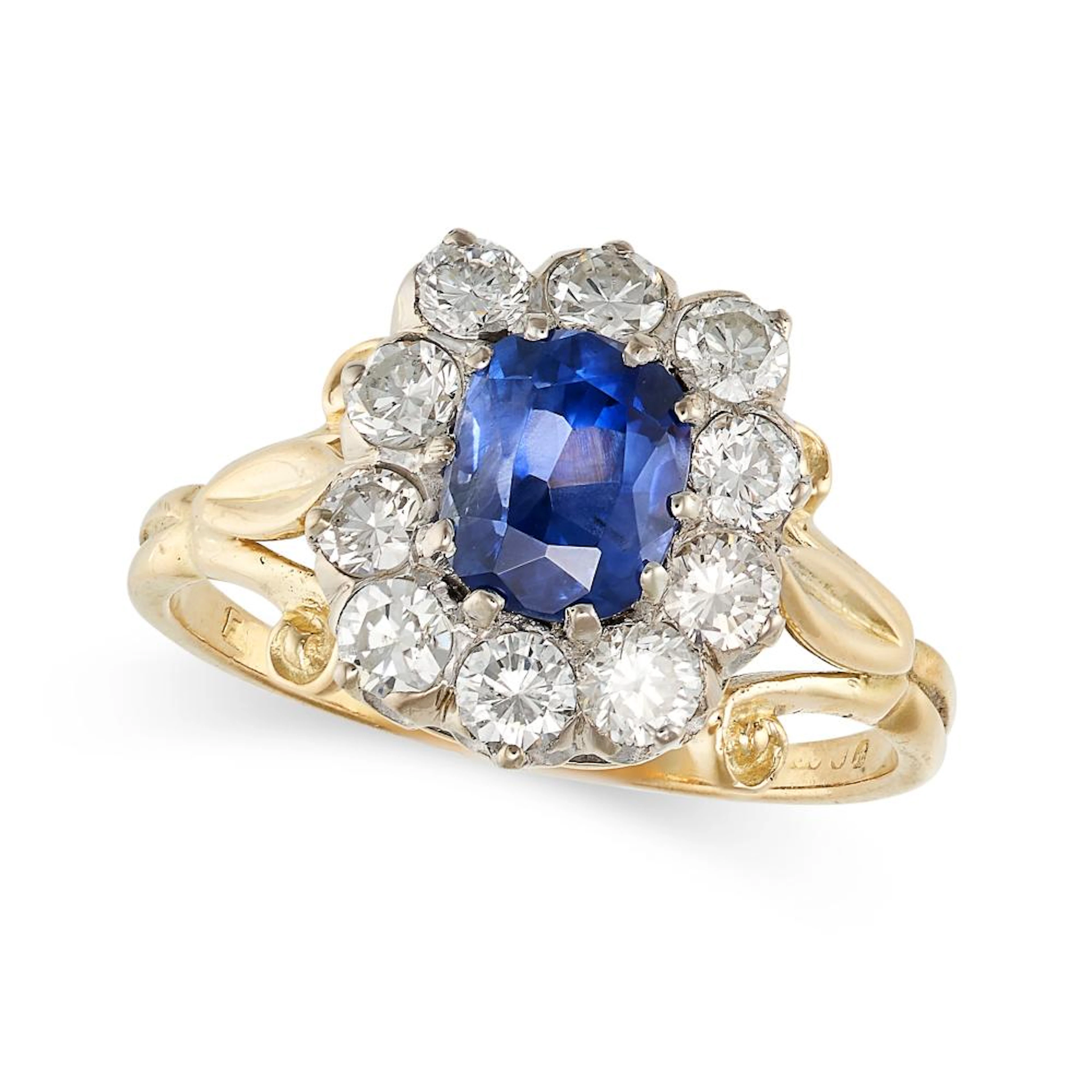 A VINTAGE SAPPHIRE AND DIAMOND CLUSTER RING in yellow gold