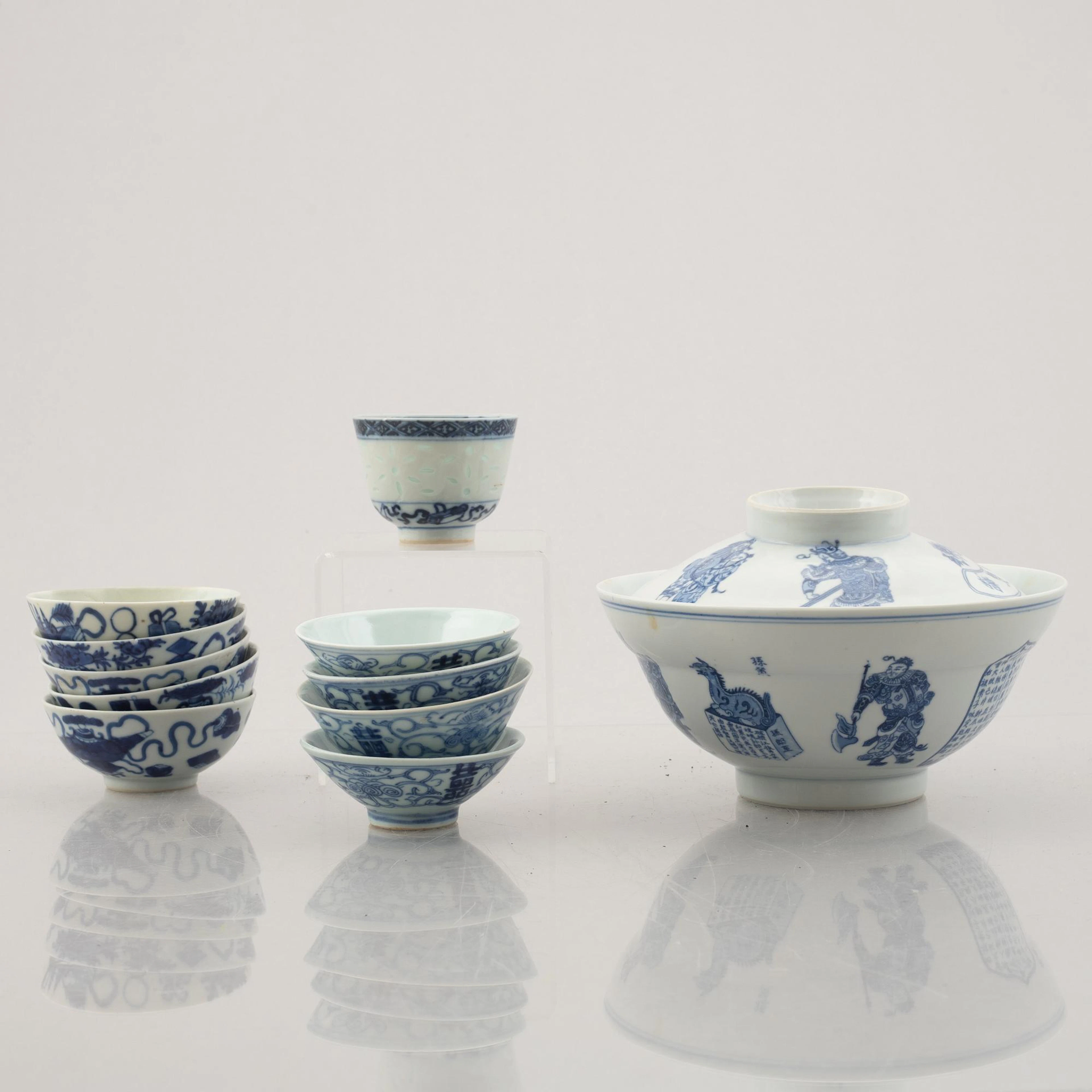 A group of ten Chinese blue and white porcelain cups and a bowl with cover
