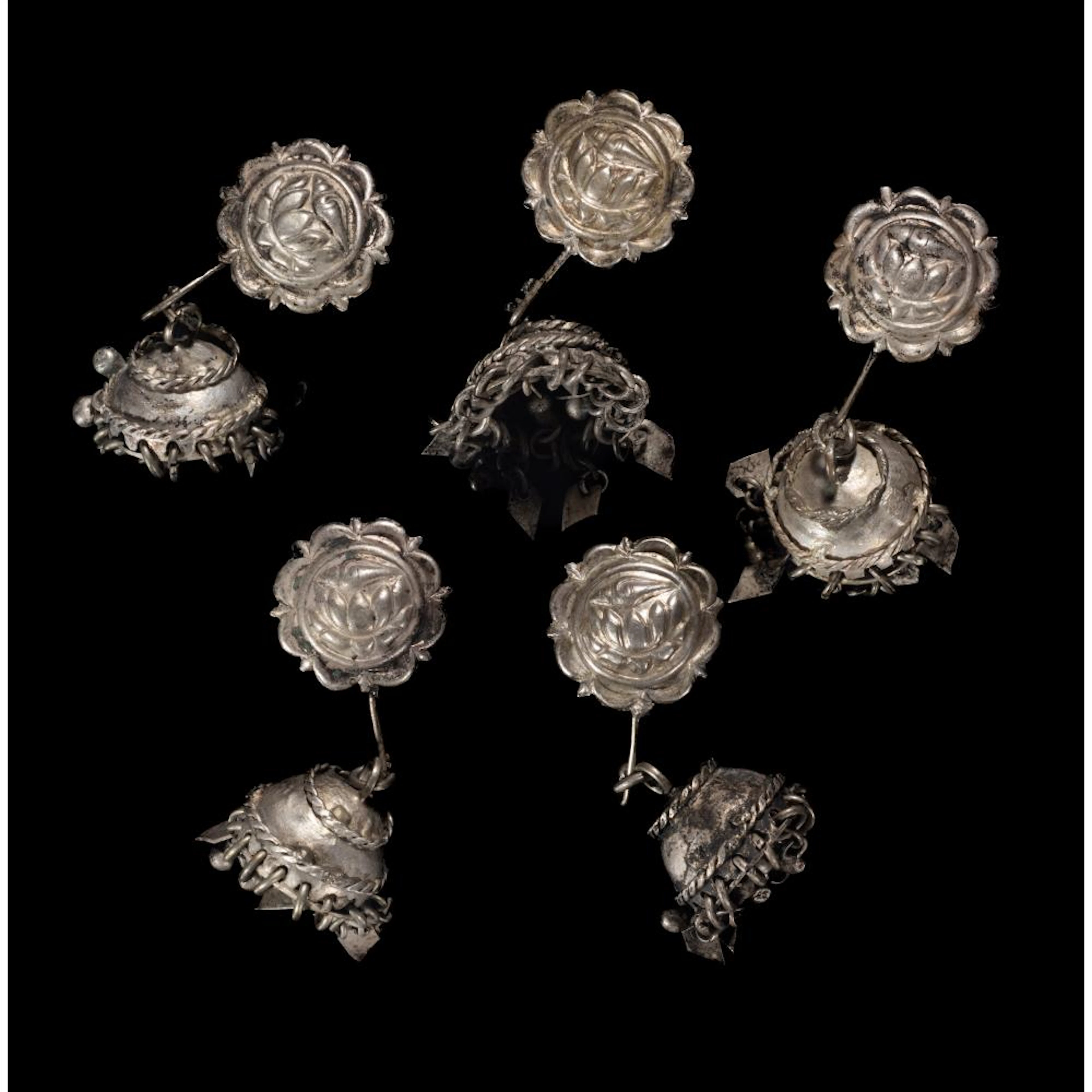 FIVE SILVER ALLOY EAR ORNAMENTS, INDONESIA, 19TH CENTURY