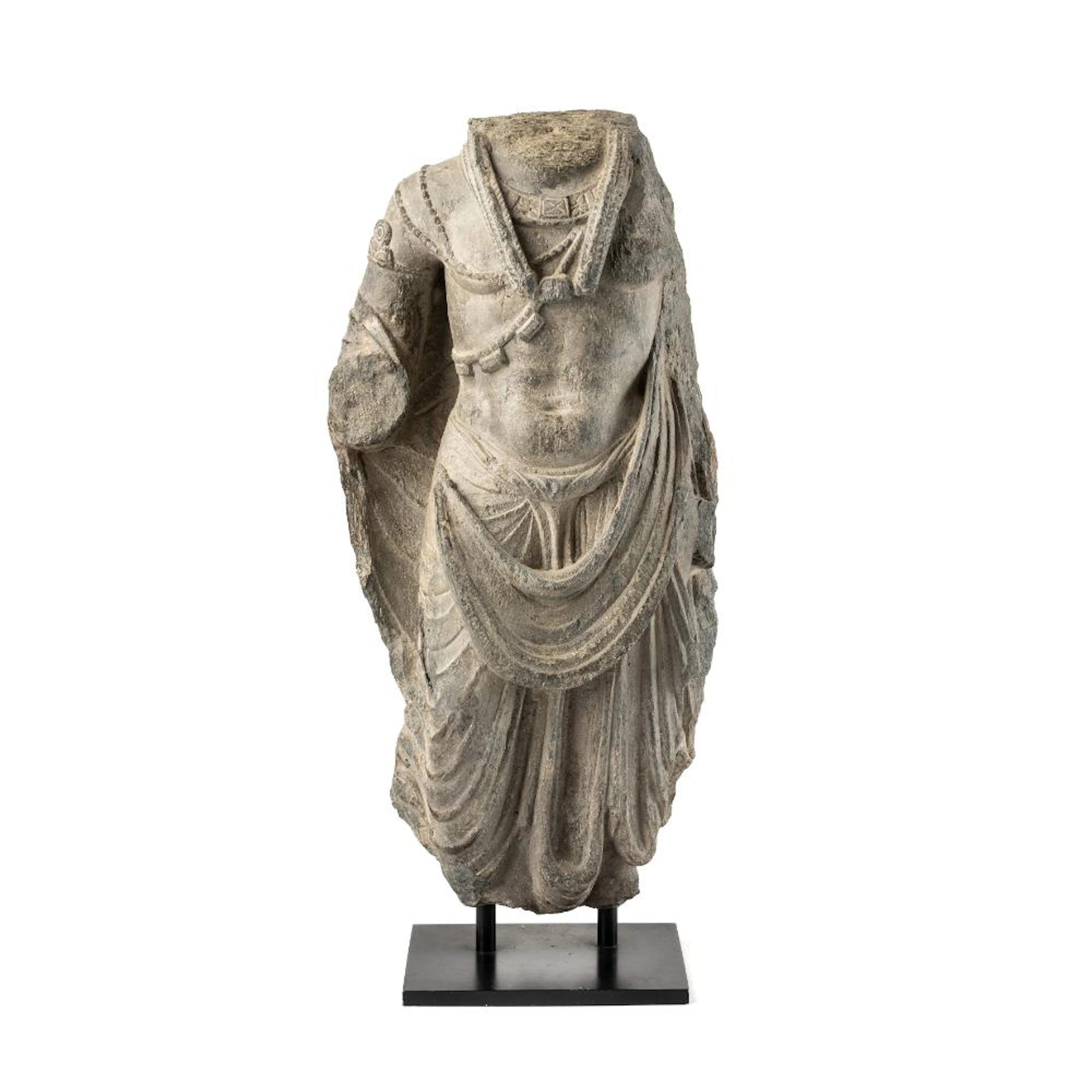 A GANDHARA GREY SCHIST TORSO PROBABLY OF MAITREYA