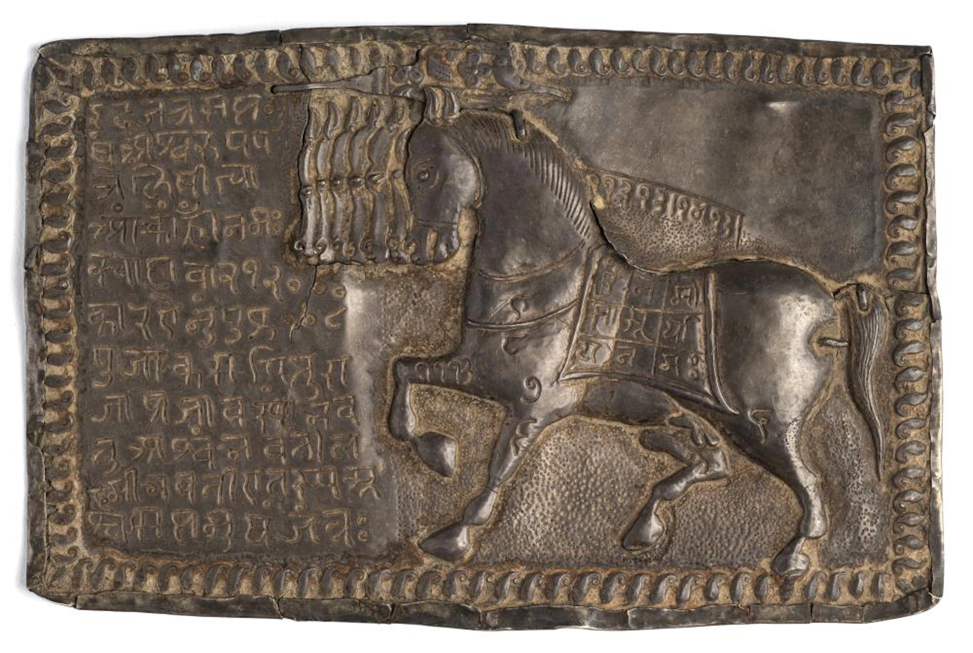 A SILVER VOTIVE PLAQUE DEPICTING UCHCHAIHSHRAVAS