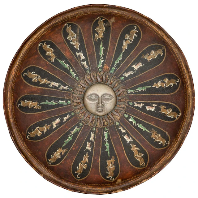 AN INDIAN LACQUERED HIDE SHIELD, 19TH CENTURY, POSSIBLY JAIPUR
