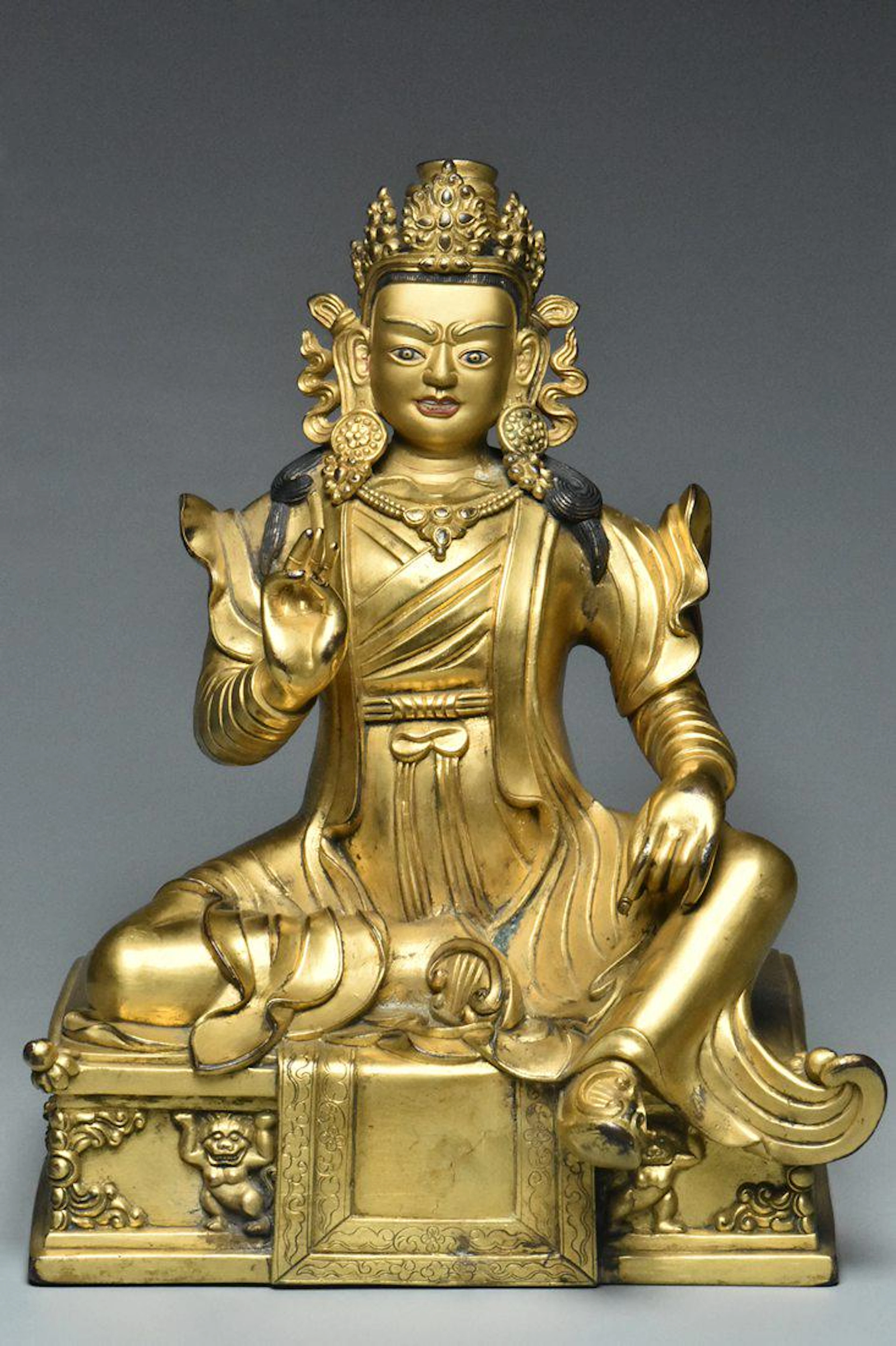 A qing gilt bronze figure of padmasambhava