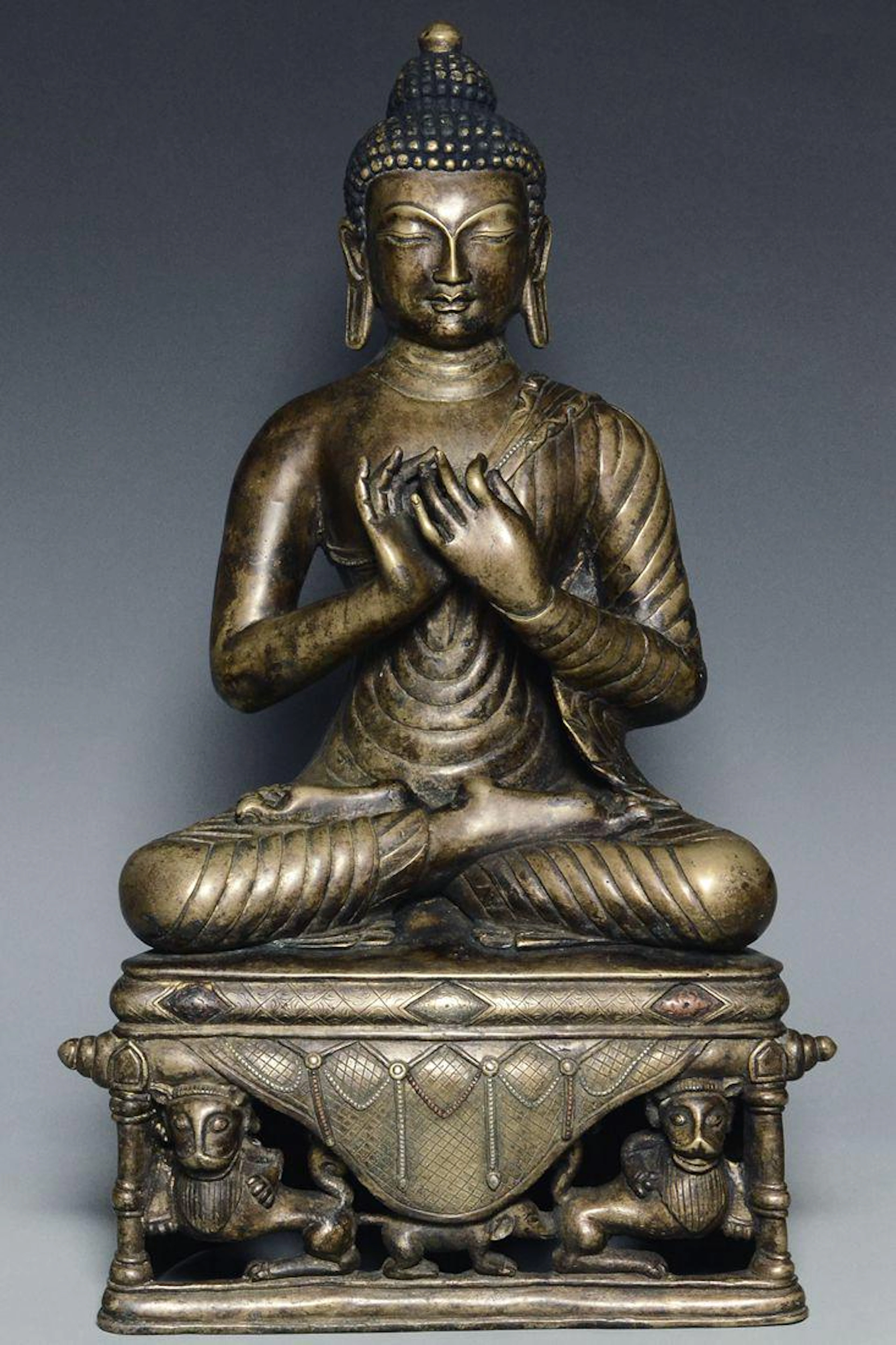 A yuan dynasty bronze figure of buddha
