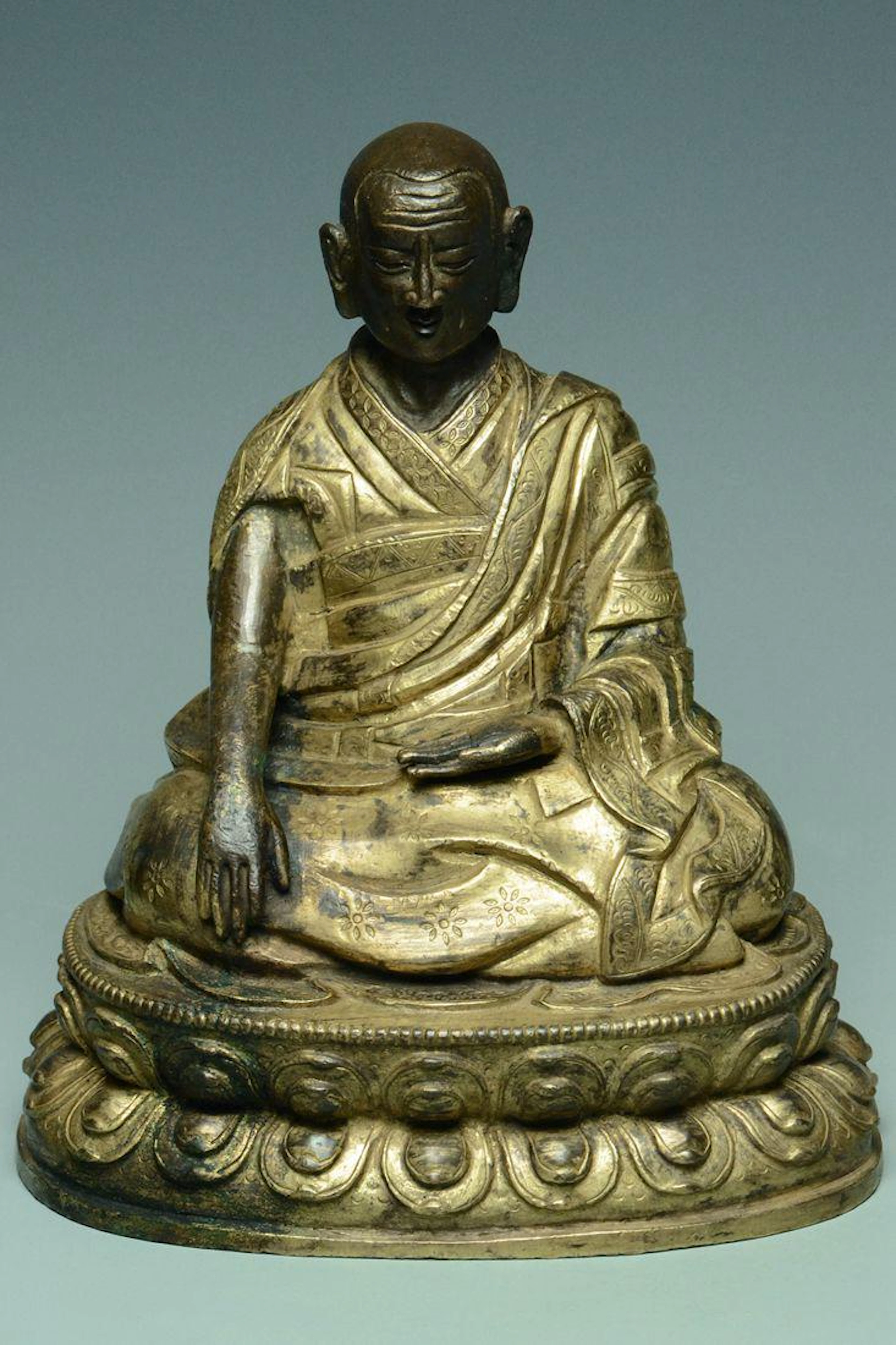 Inscribed tibetan qing dynasty gilt bronze lama