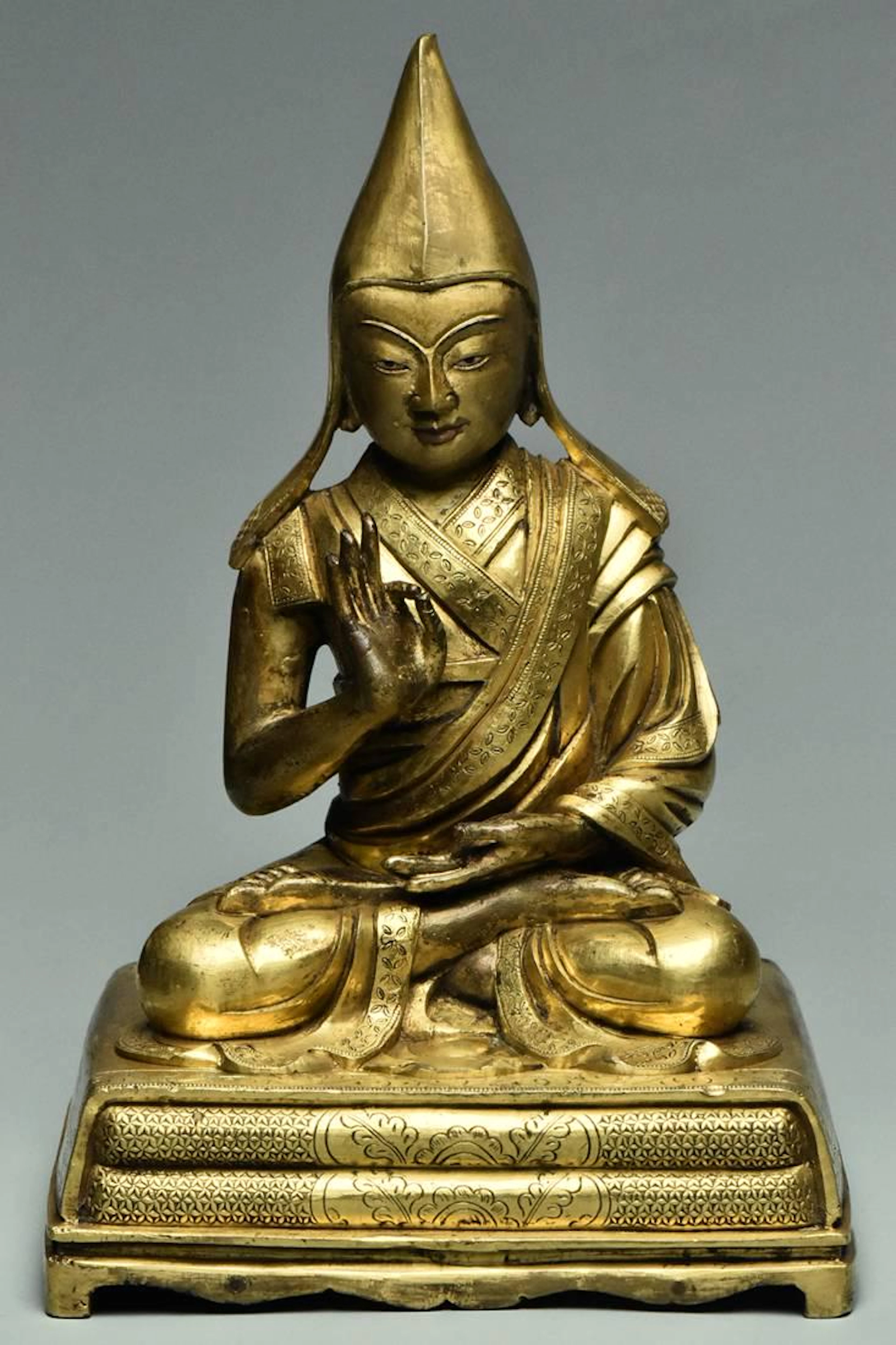 A sino-tibetan gilt bronze figure of tsongkapa