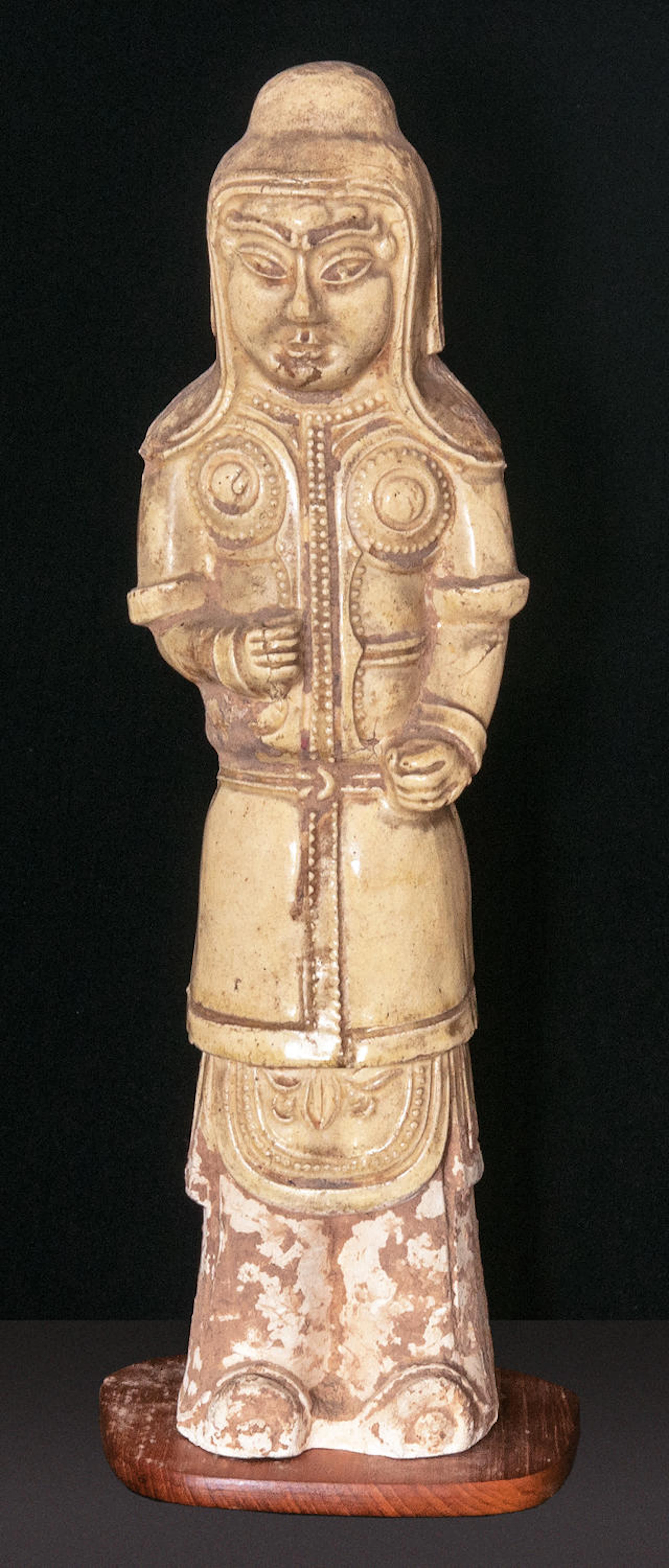 A handsome and rare pottery figure of a warrior