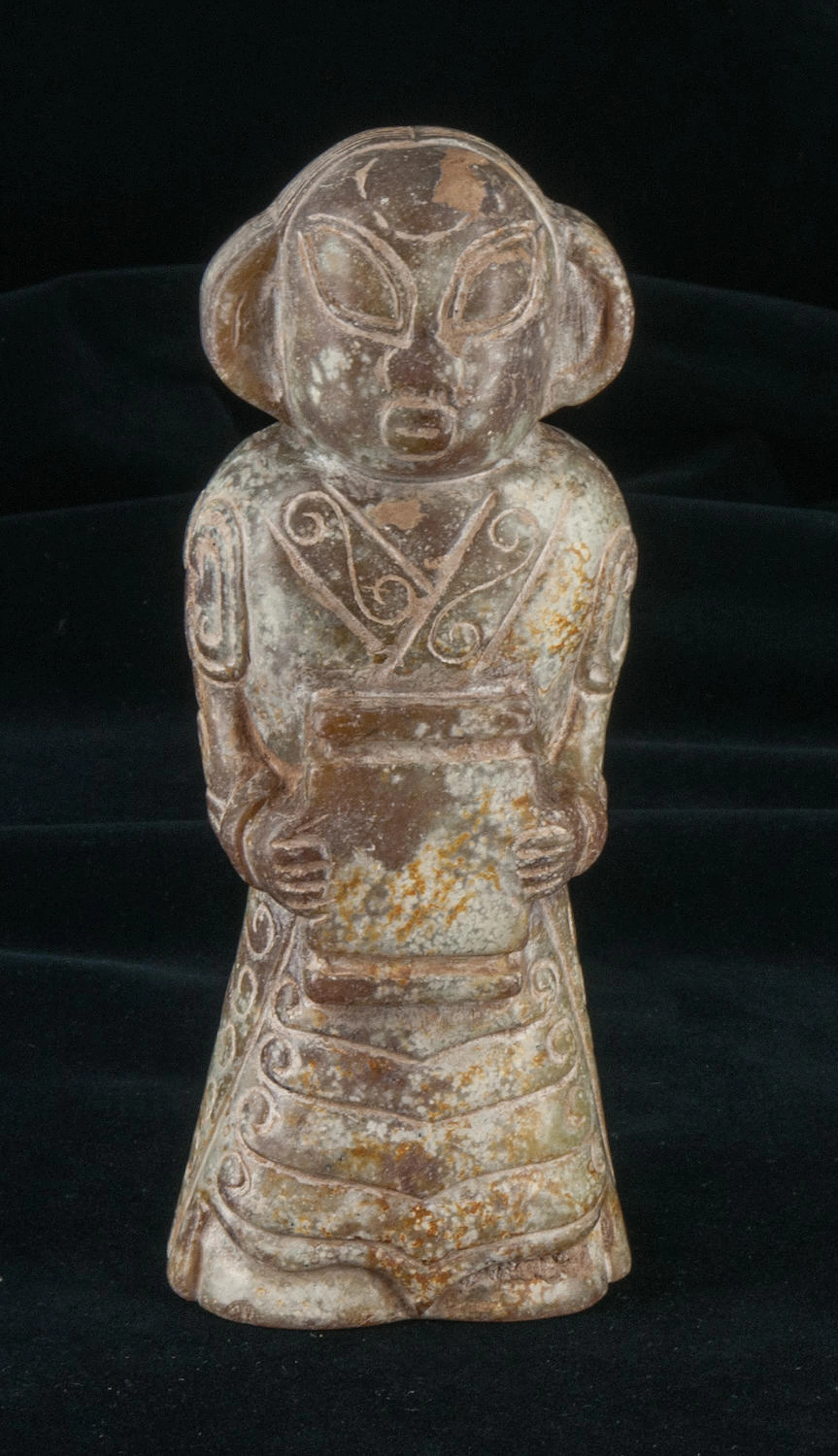 A very rare and fine small white-brown jade carving of a human figure