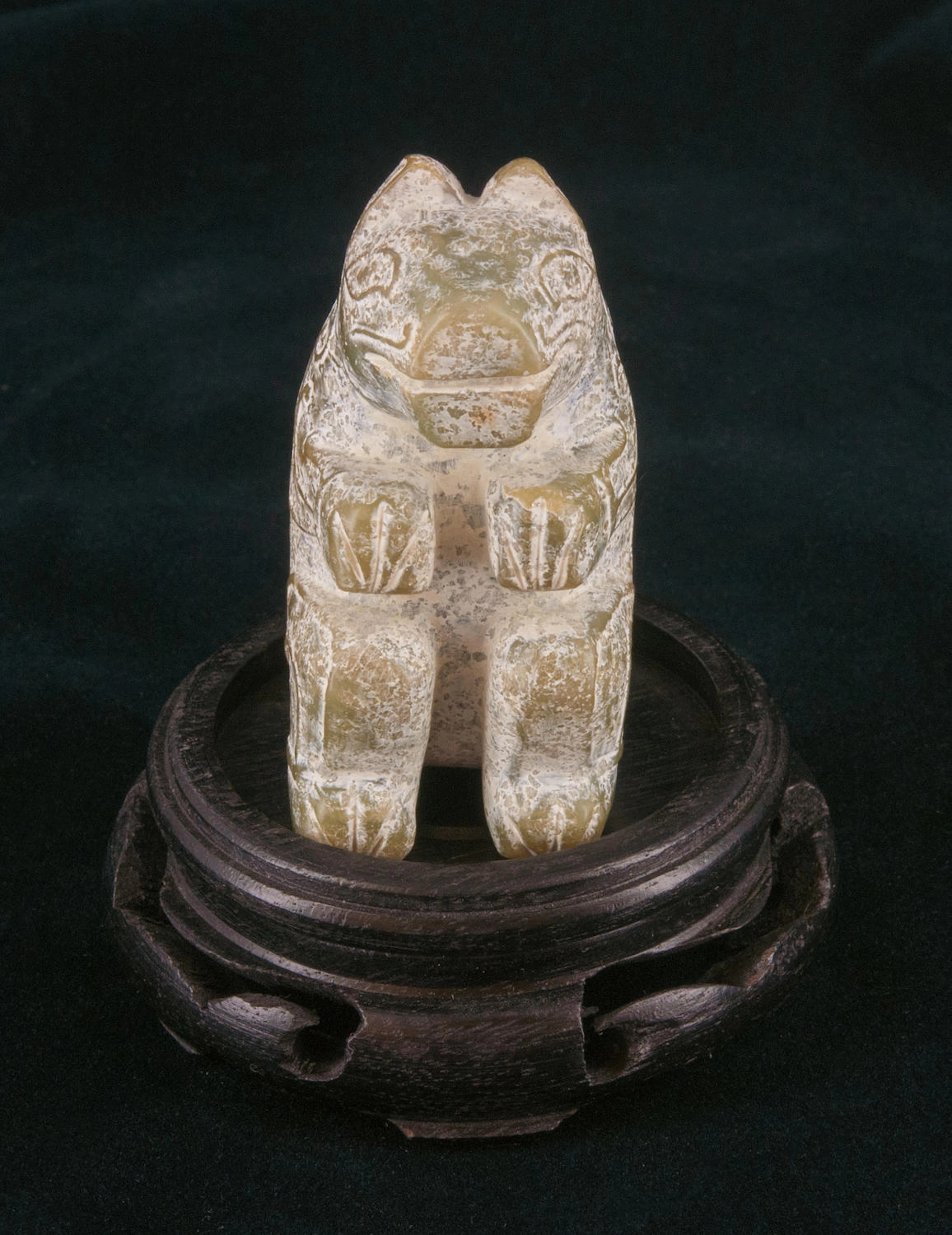 A very rare and attractive light green jade carving of a bear