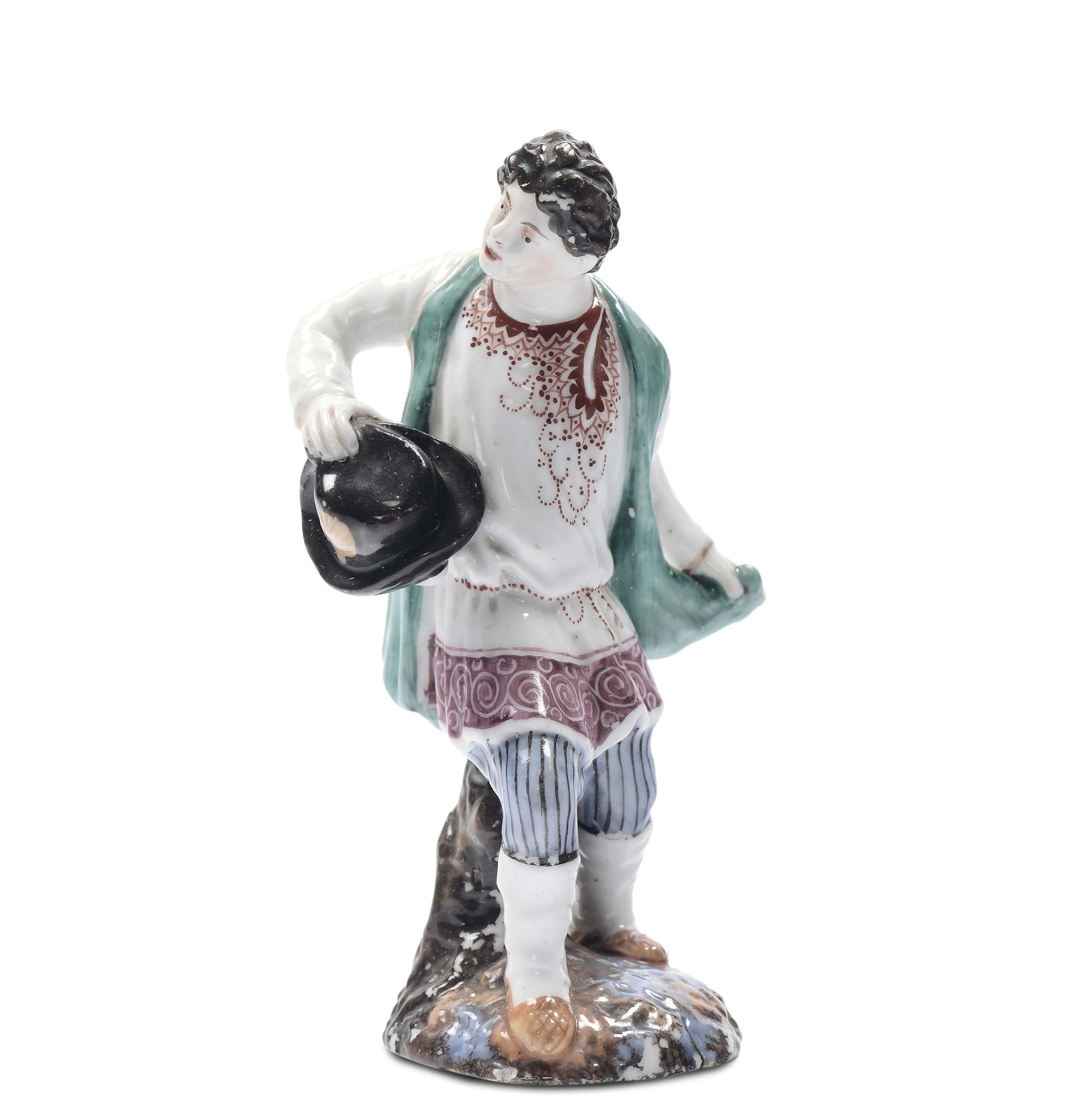 Figuretta in porcellana policroma di giovane contadino in costume