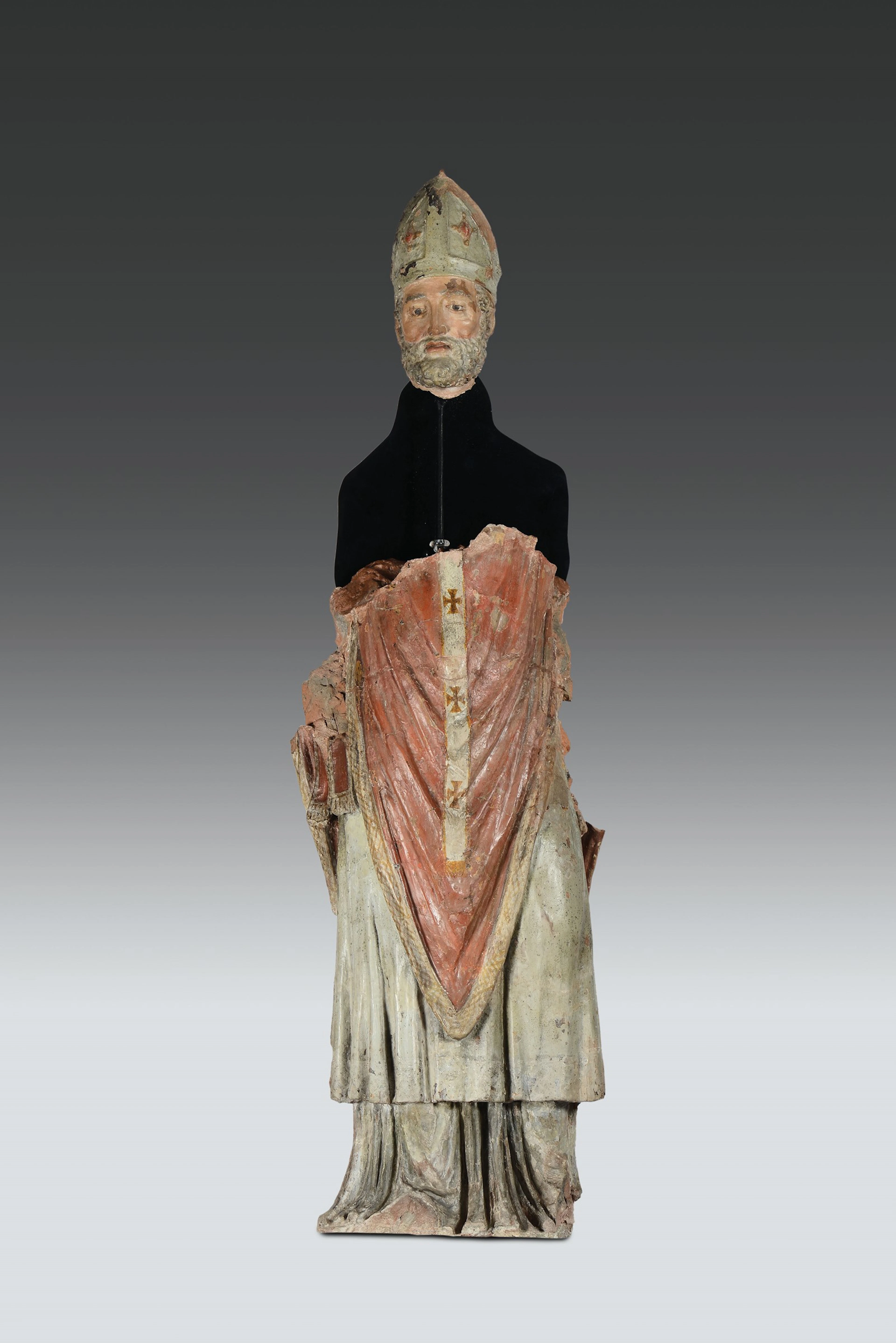 Parte di scultura in terracotta policroma raffigurante Santo Vescovo.