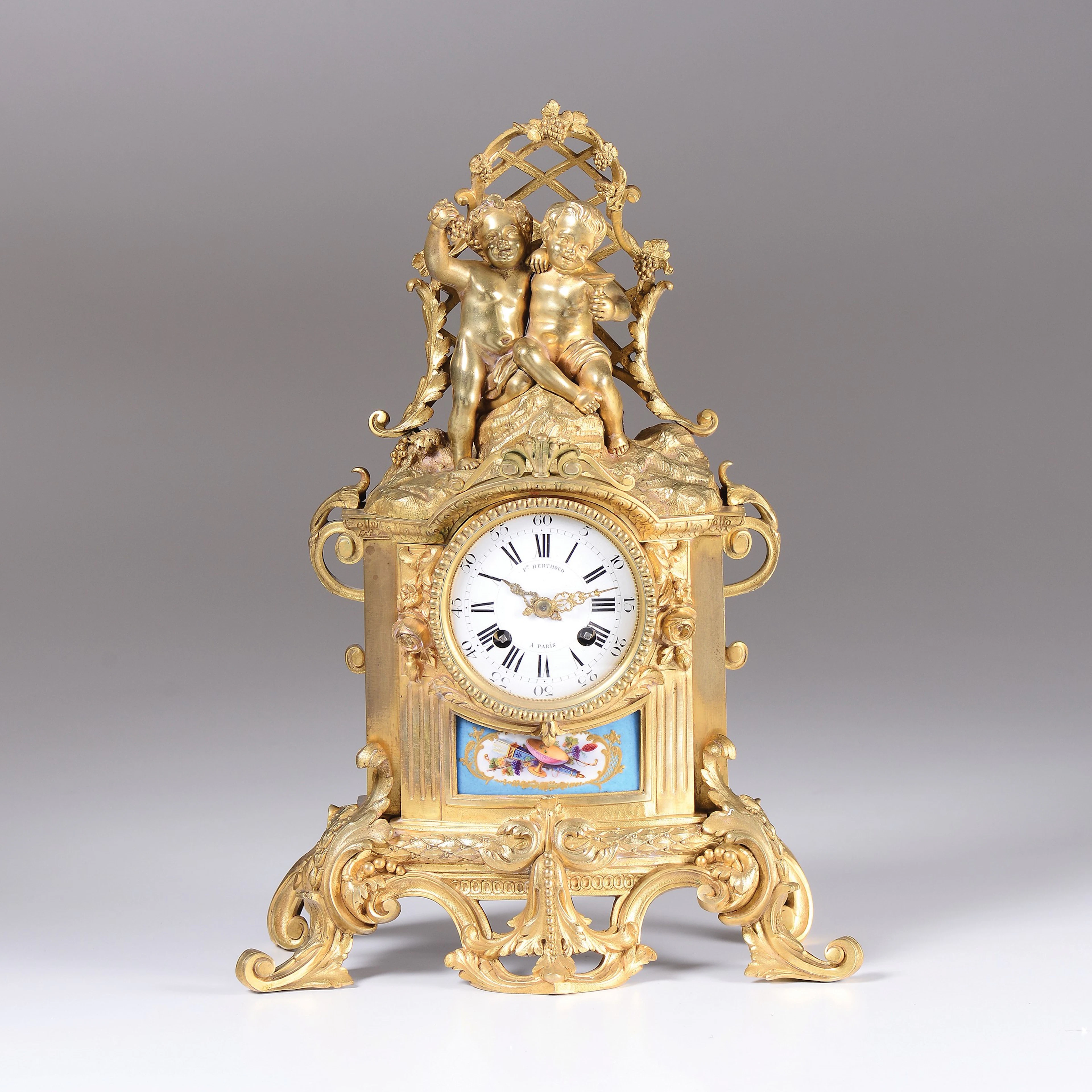 An ormolu clock with Sevres porcelain panels, F. Berthoud, France