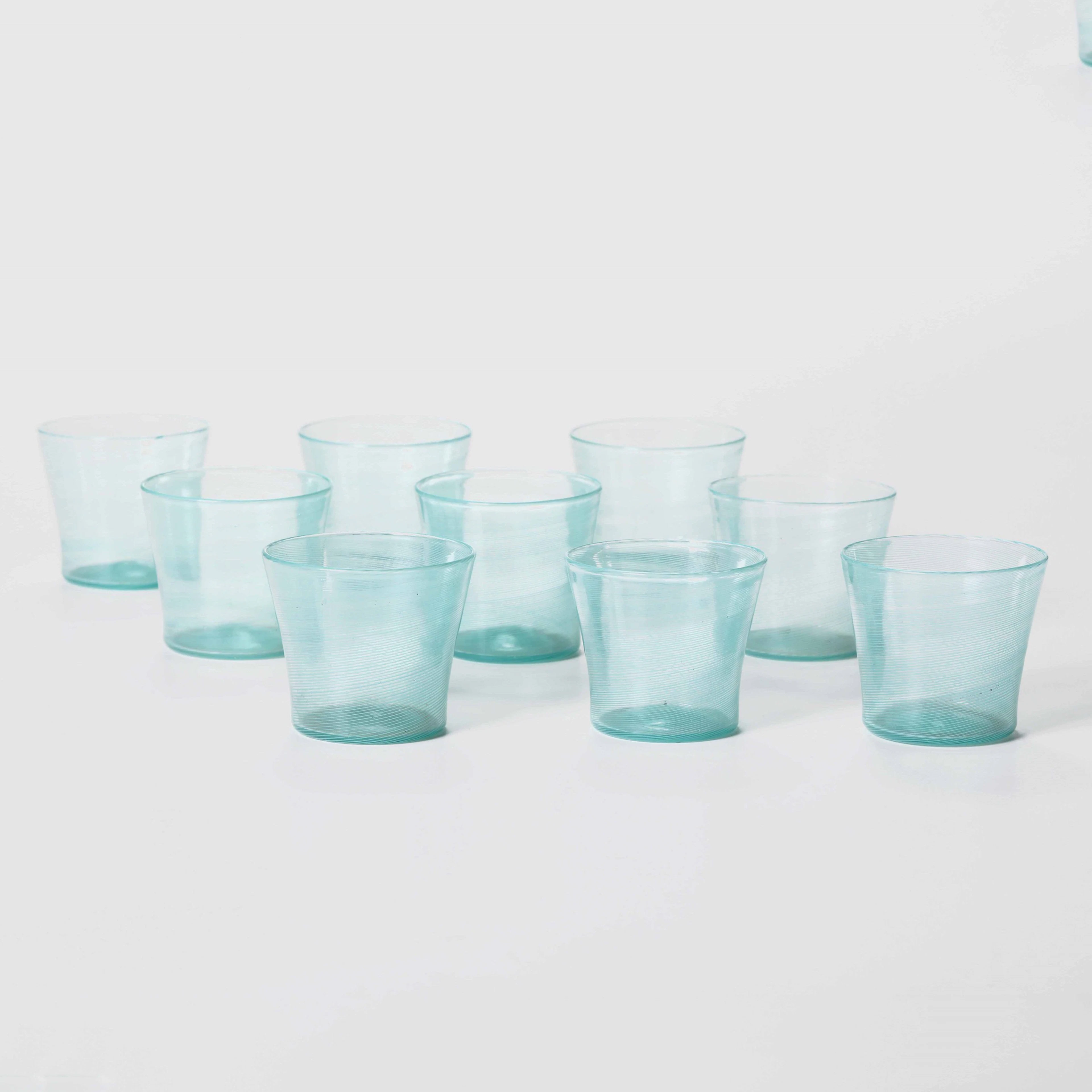 Carlo Scarpa, Venini, Murano, 1940 ca. Nine hourglass glasses in green