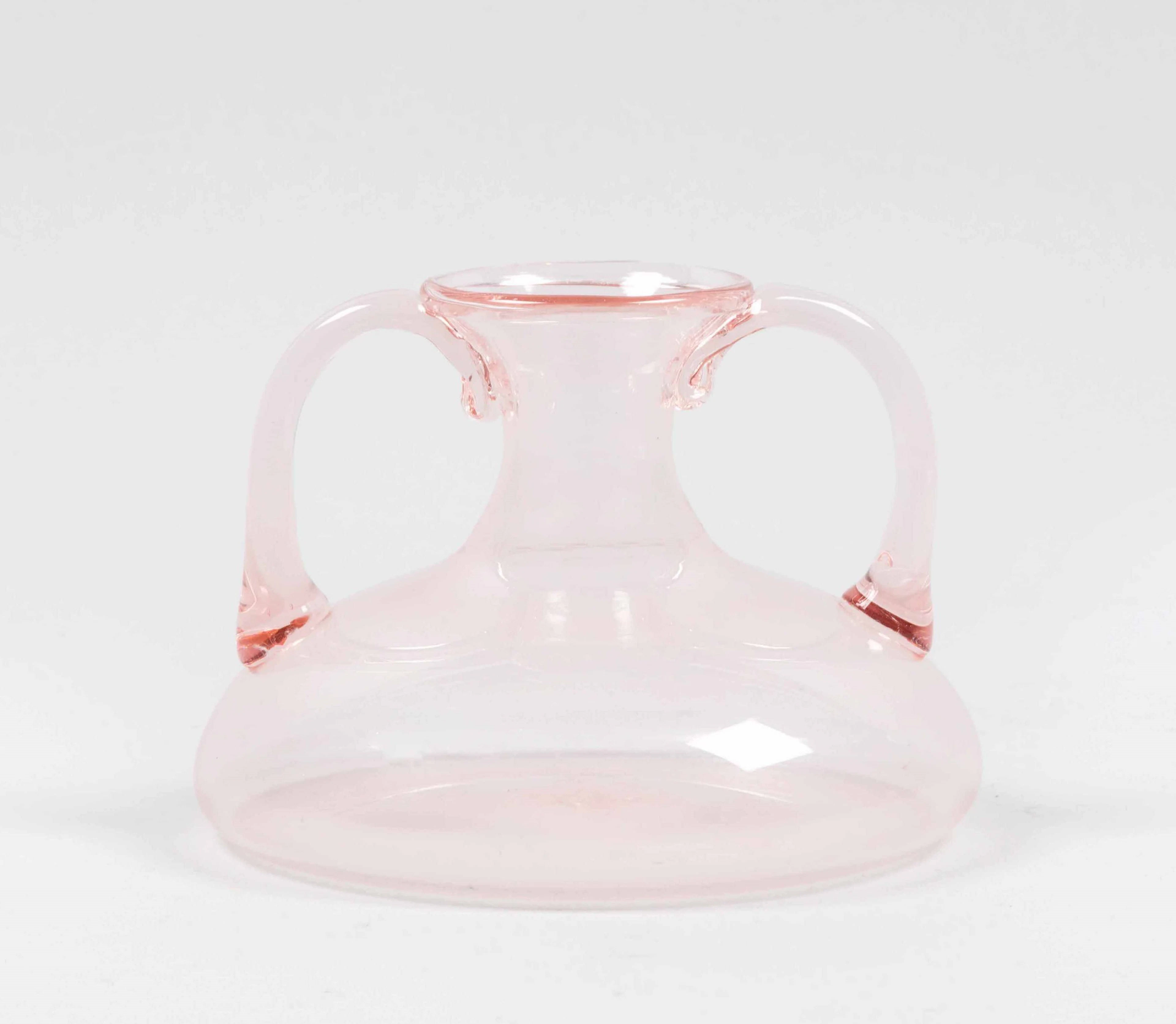 Murano, 1930. A vase in rose-coloured blown glass with large applied handles