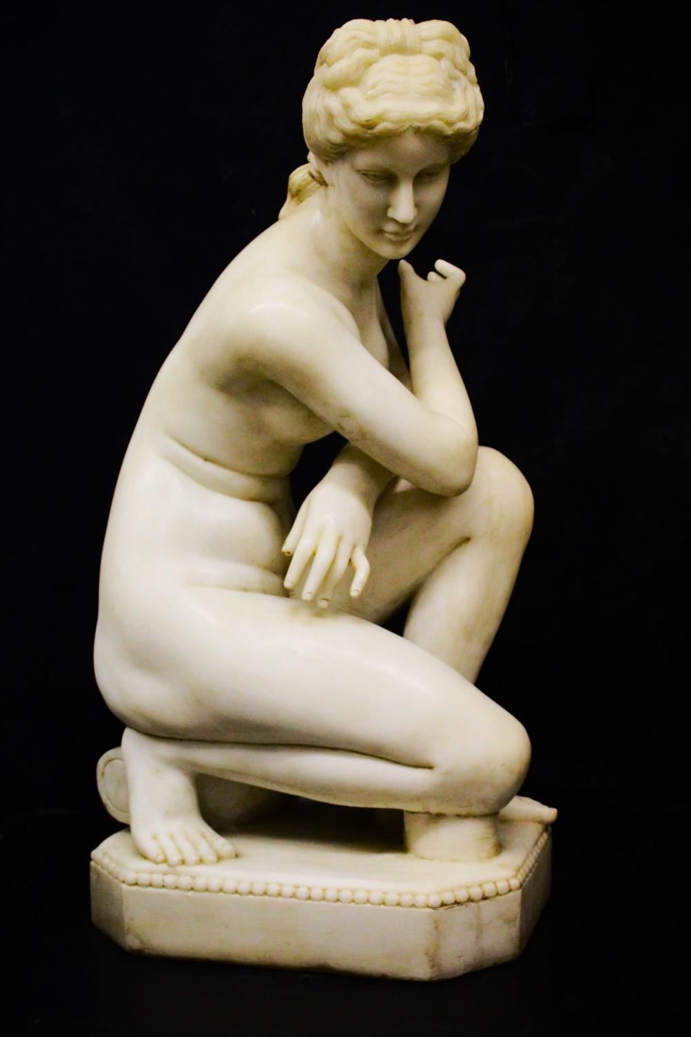 Marble statue of kneeling Venus.
