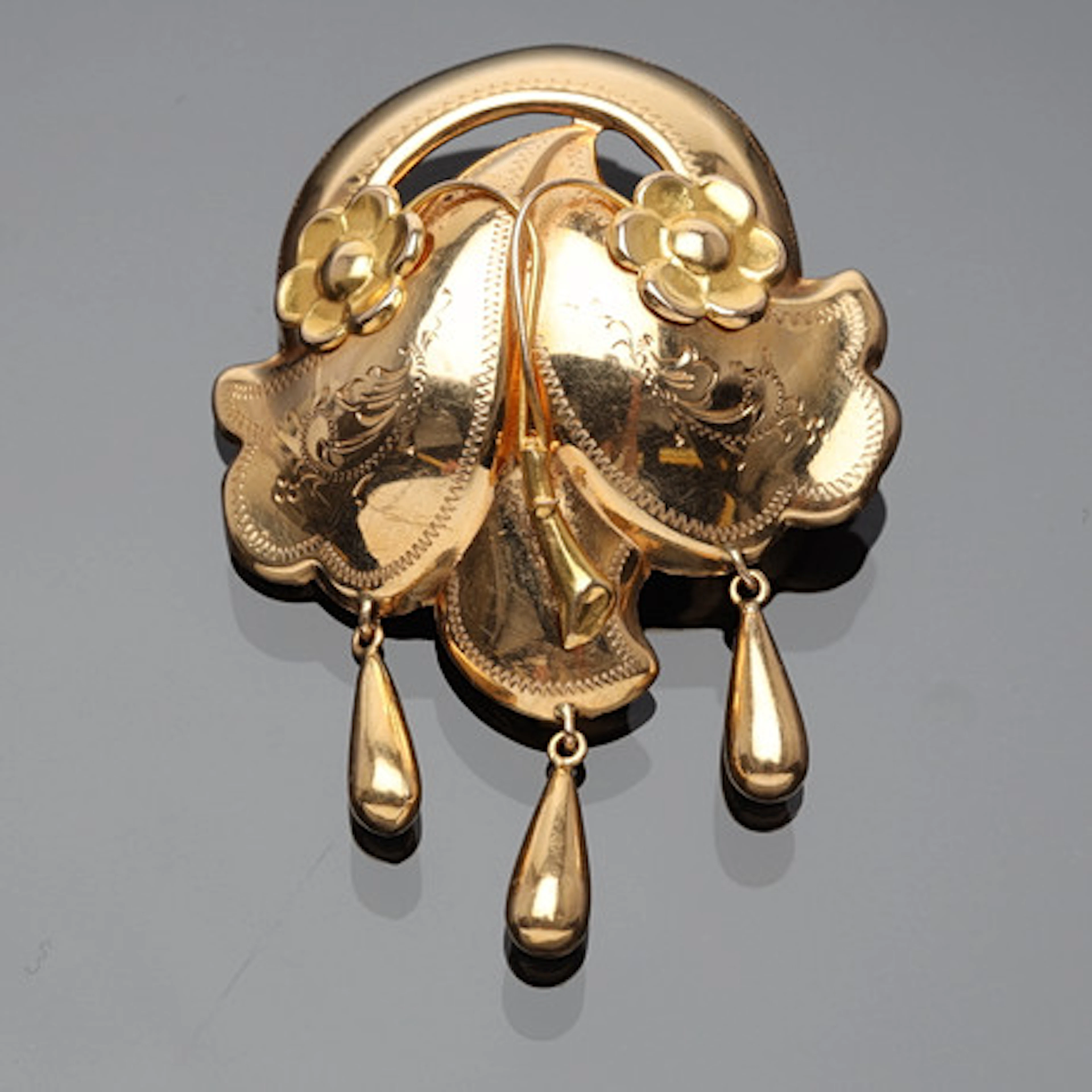 BROSCH 18K guld.