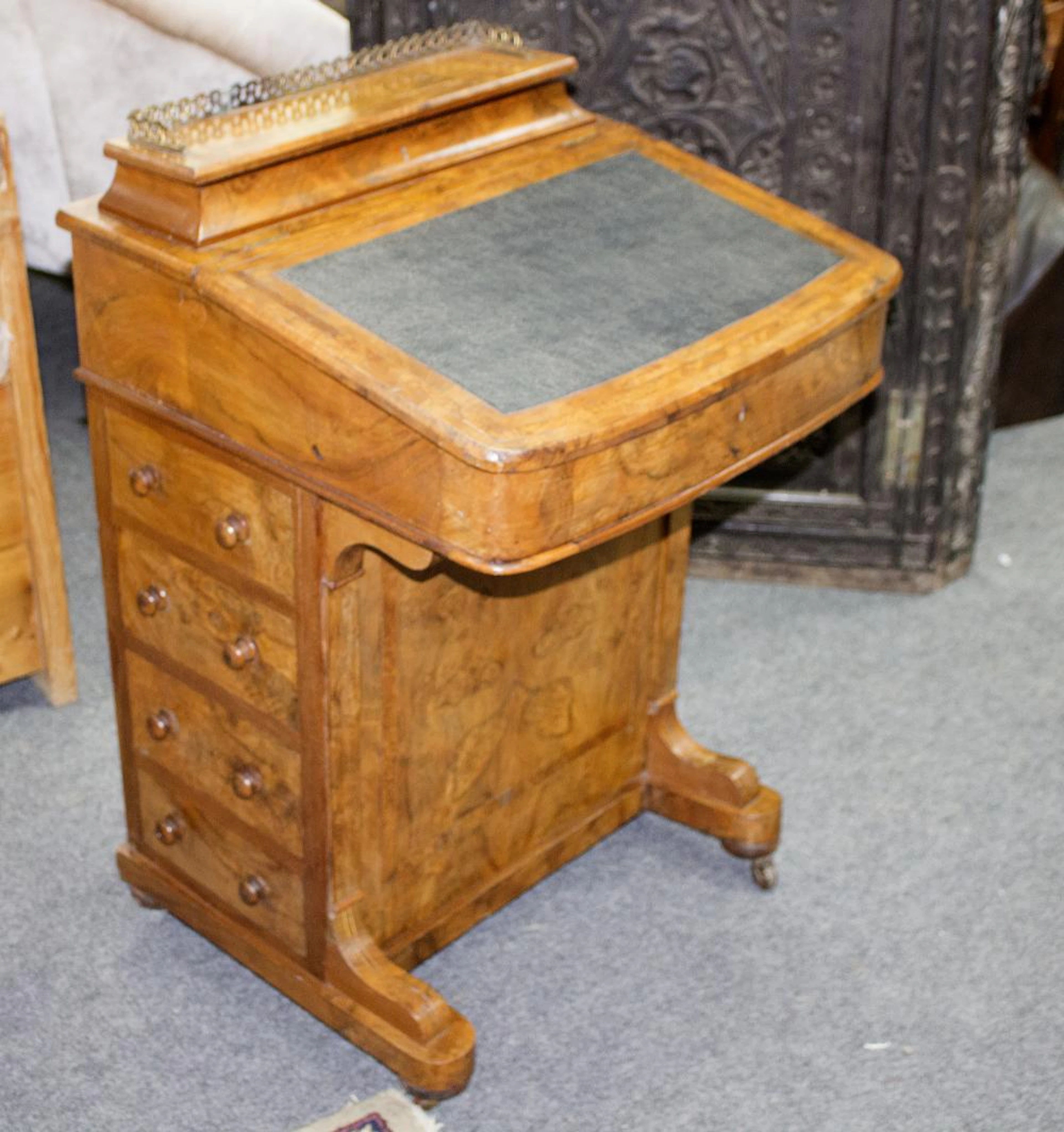 A Victorian walnut Davenport with stationery compartment...