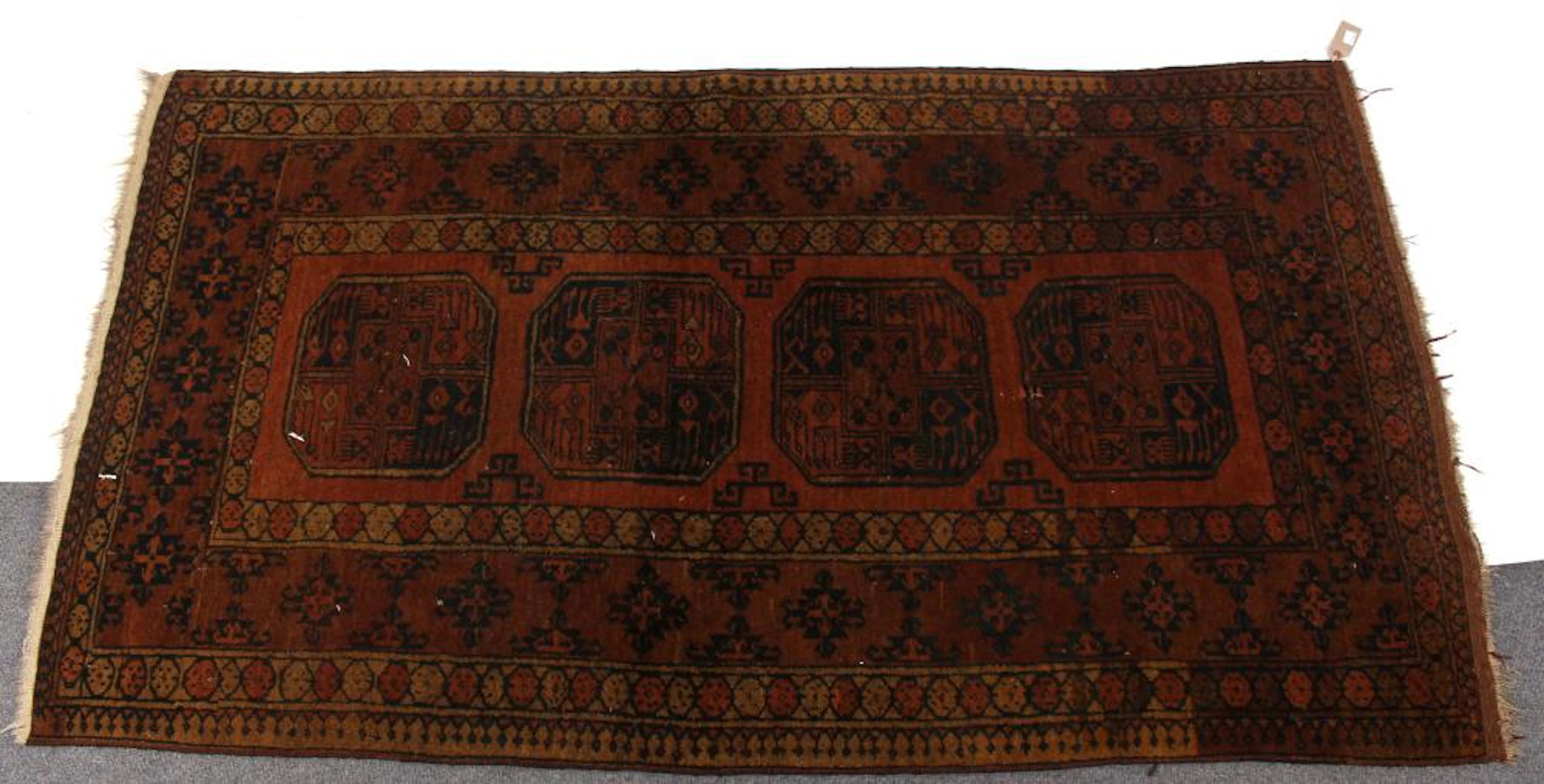 A Kurdish rug with central pole medallion to a camel...