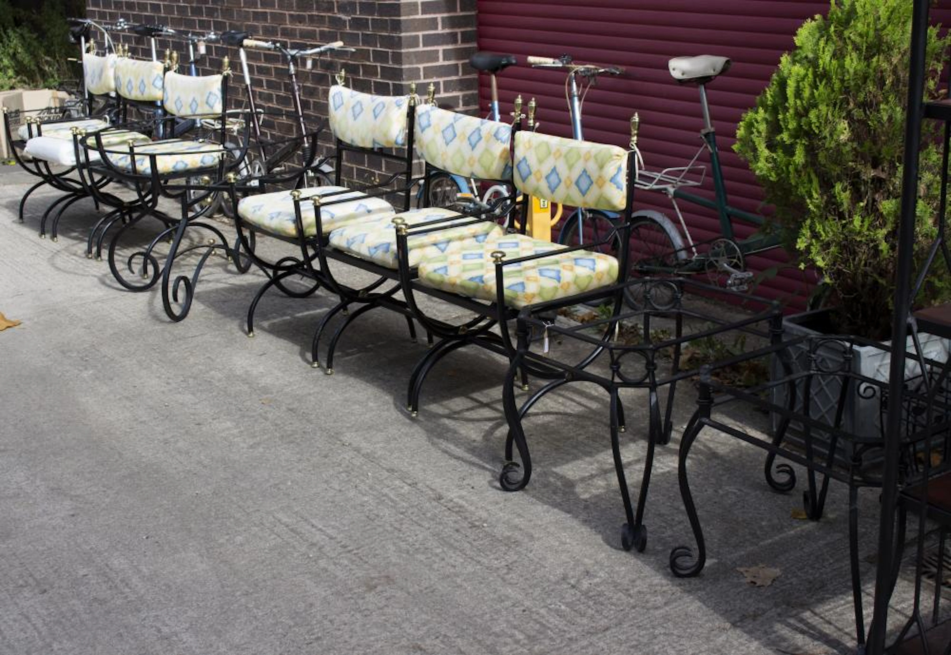A conservatory table, six chairs, two tables, magazine rack and buffet