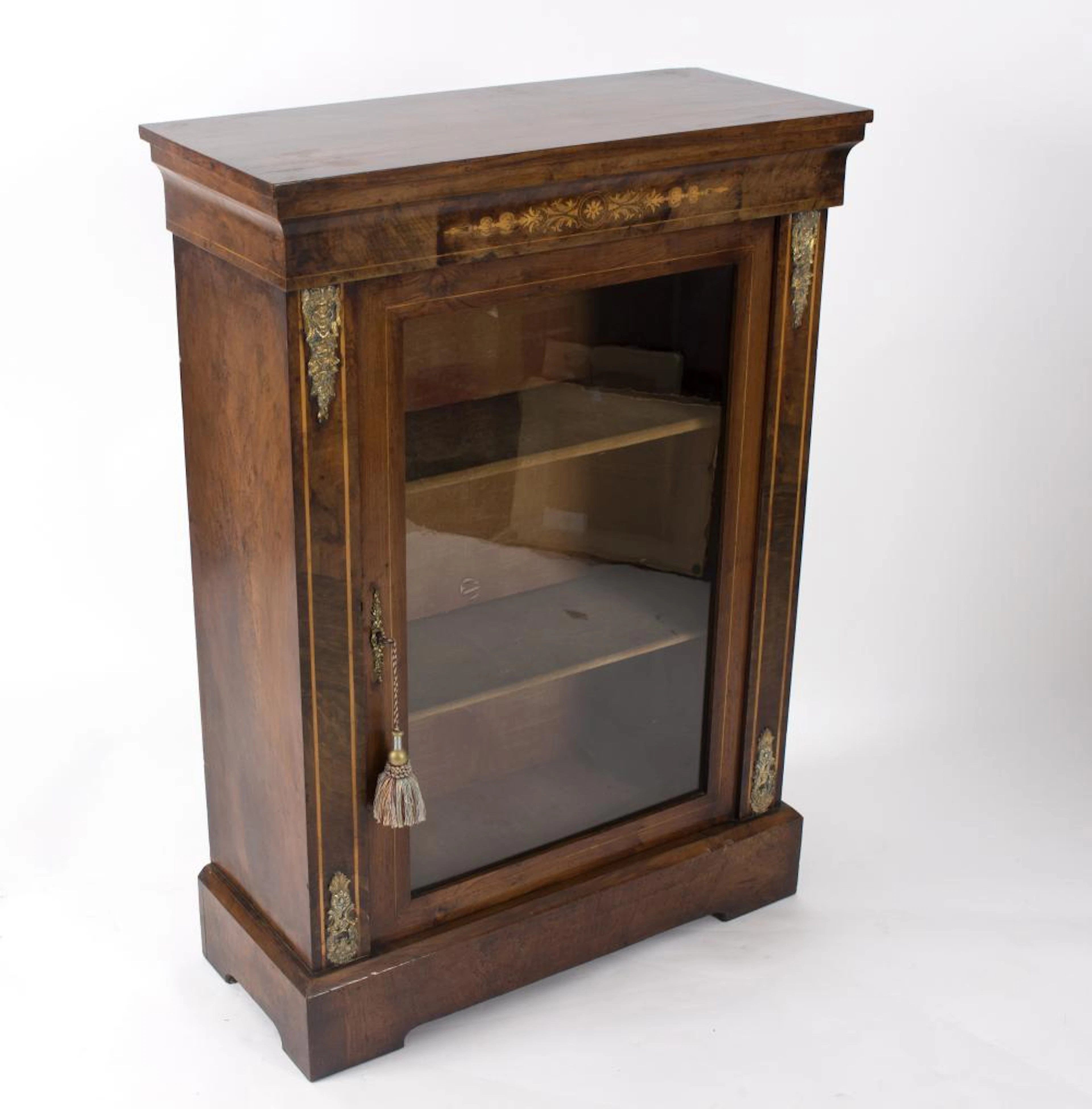 A Victorian walnut and inlaid pier cabinet with gilt metal mounts