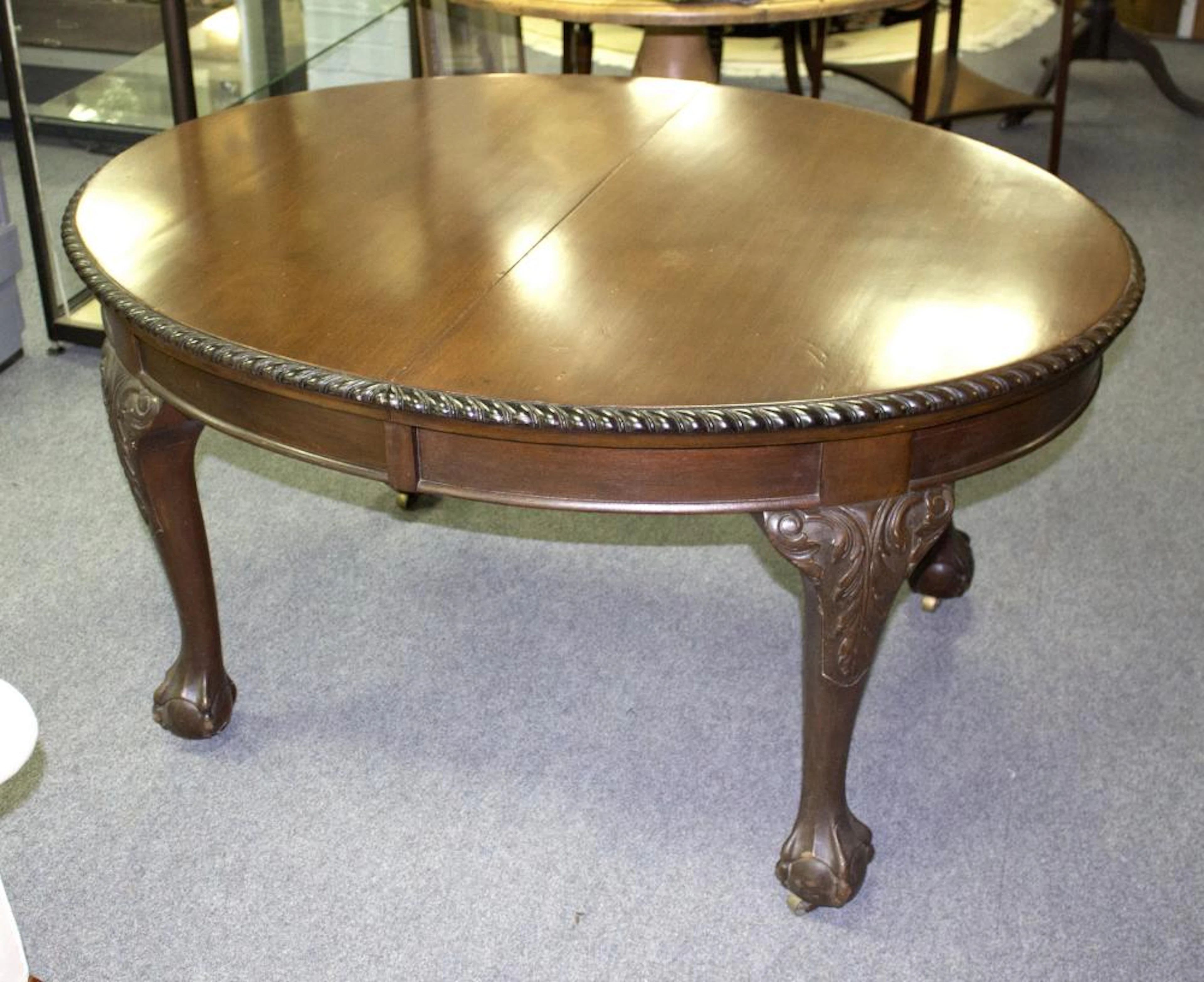 A mahogany D-end dining table on claw and ball feet, 211cm long