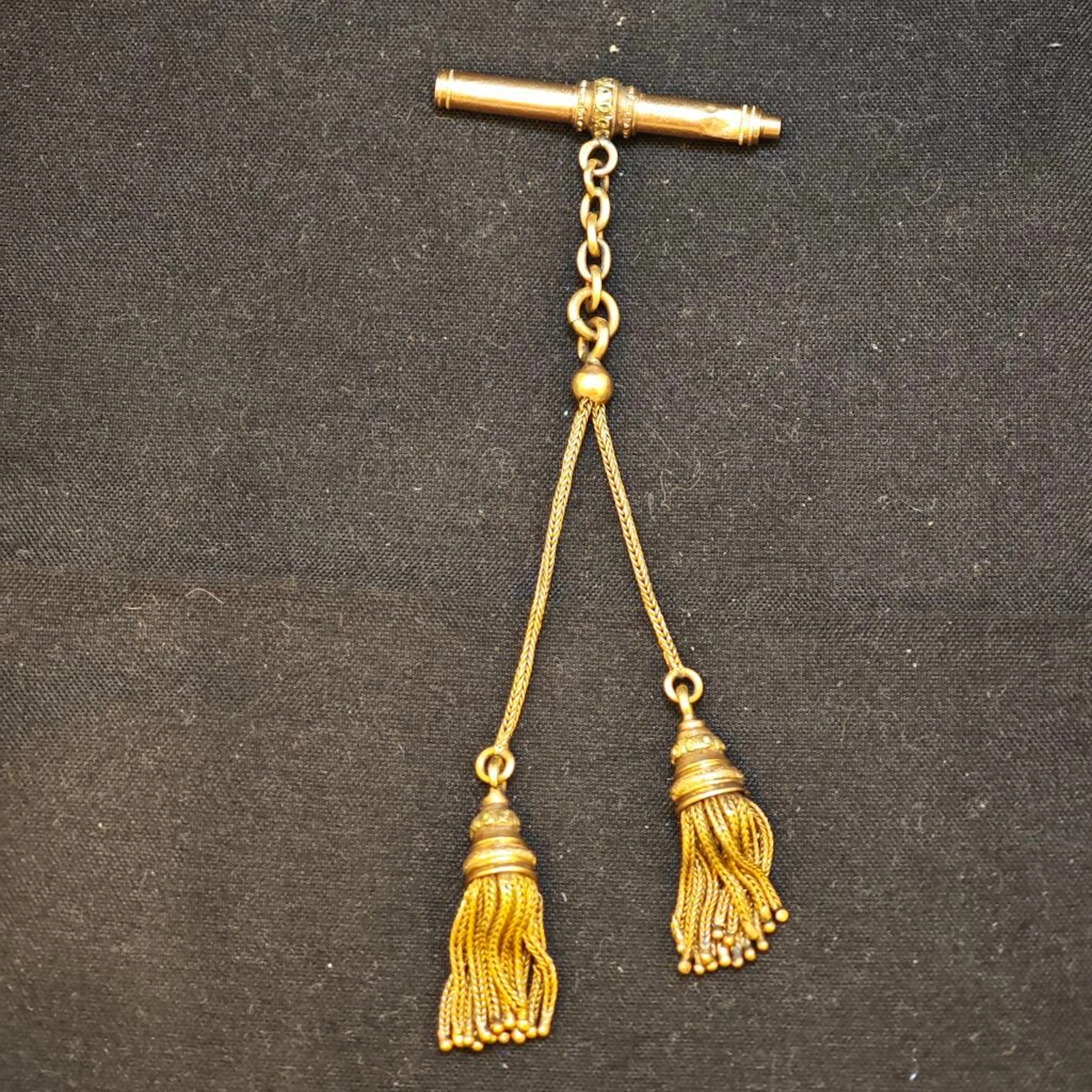 Watch key featuring a pompom negligee motif all in yellow go - Lot 94