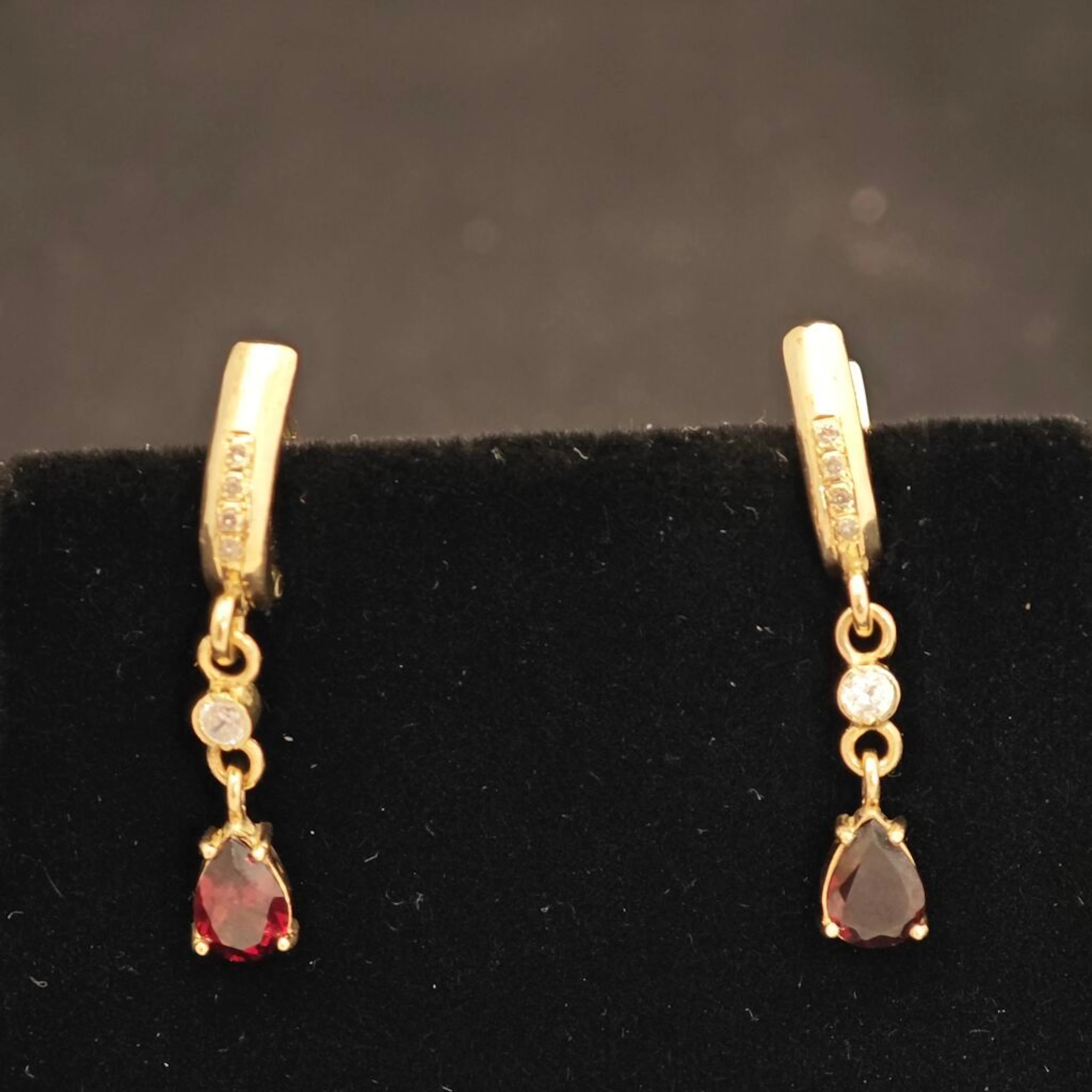 Pair of gold, diamond and garnet earrings. - Lot 101