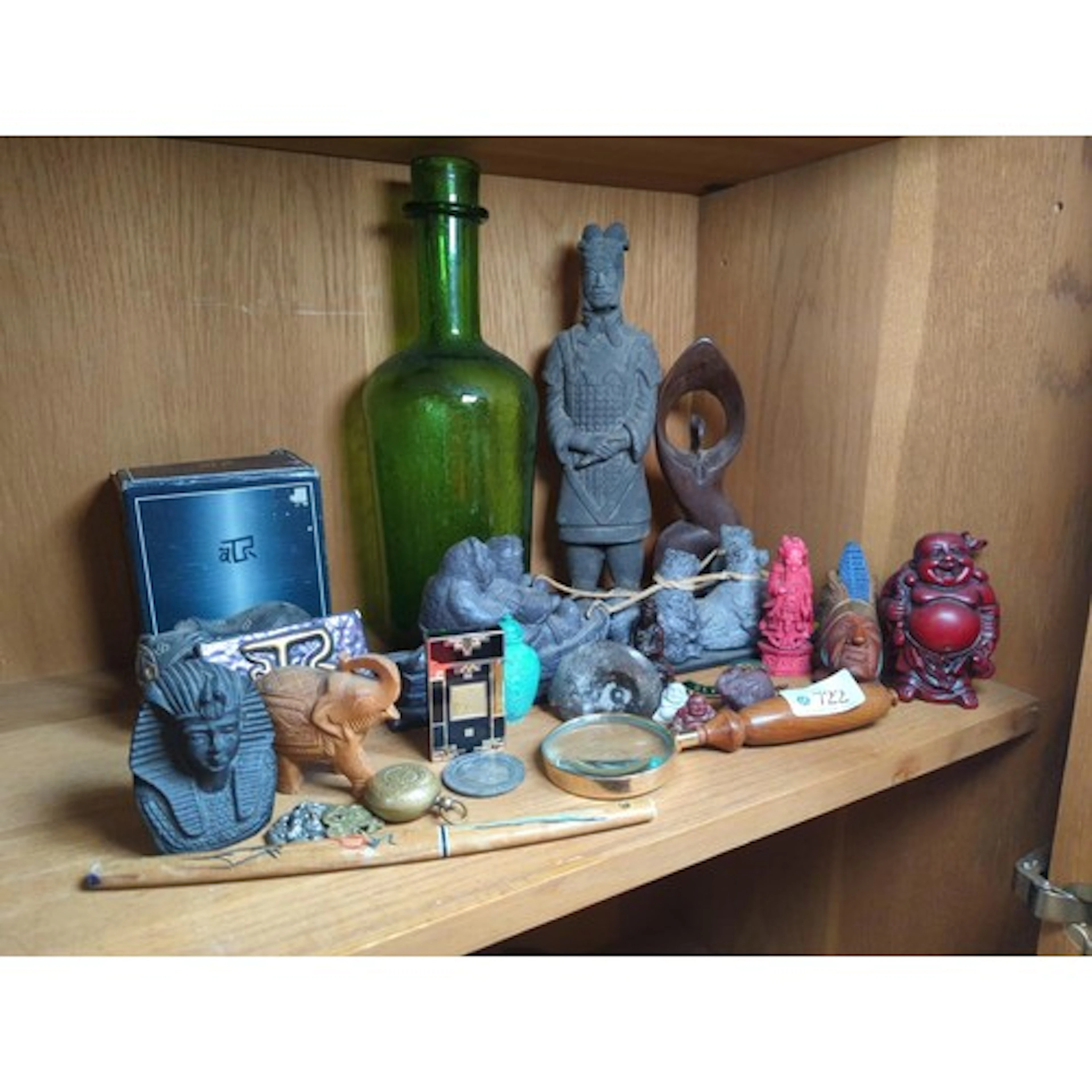 Half shelf of various collectables including Wooden Buddha, ...