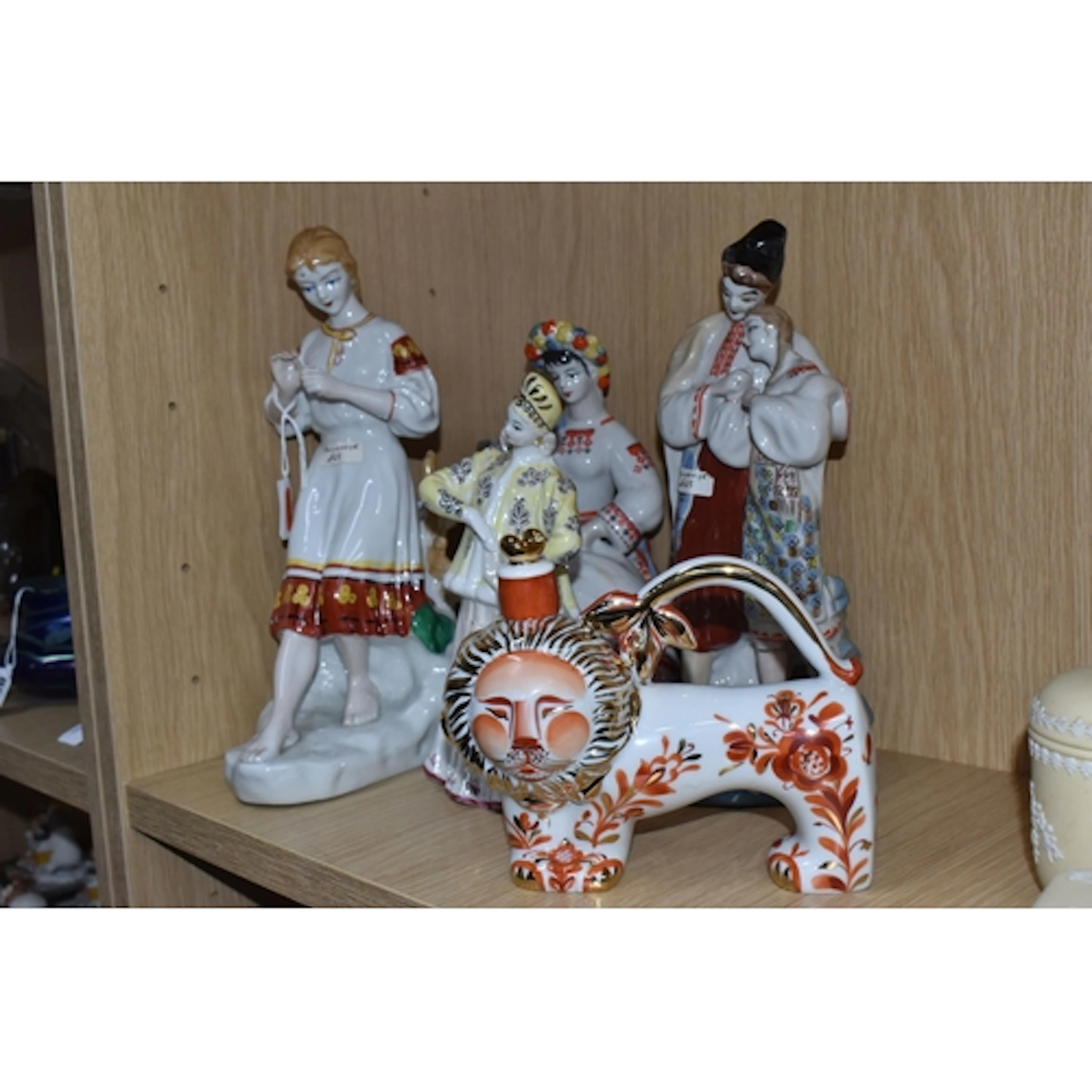 A GROUP OF SOVIET PERIOD PORCELAIN FIGURES to include a Russ...