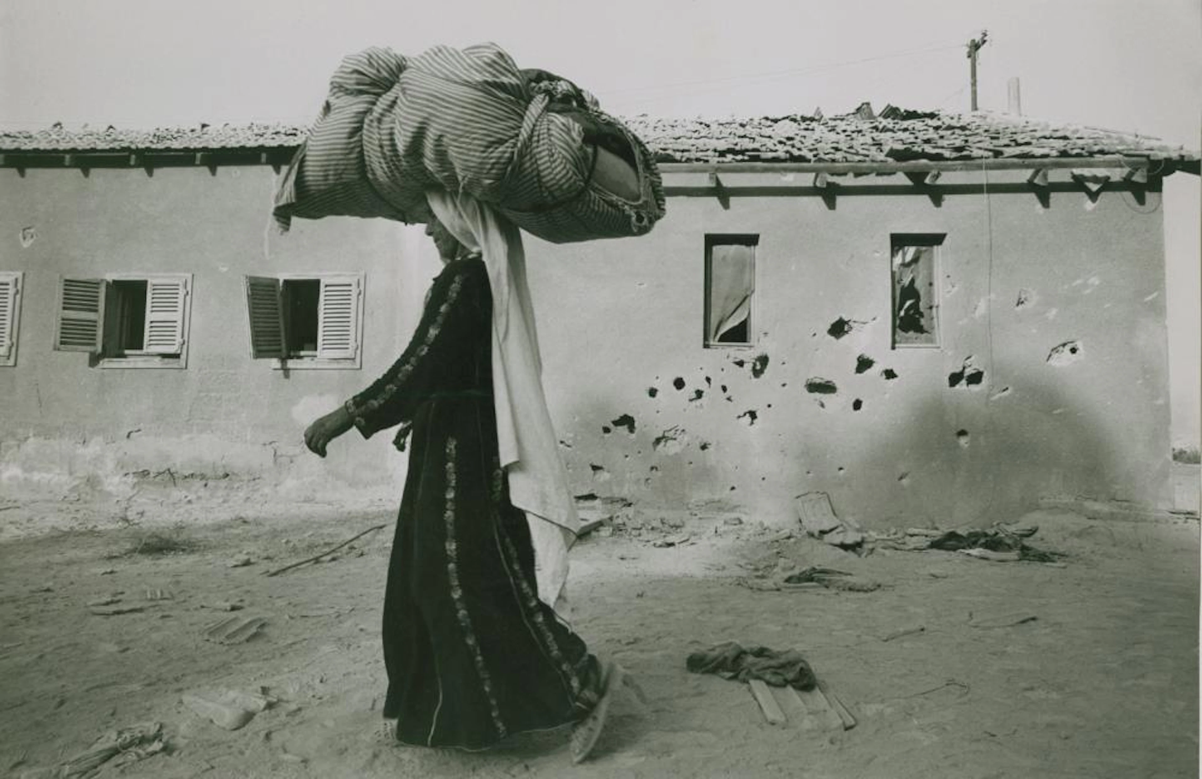 Leonard Freed. Arab refugee.bombed house 1967