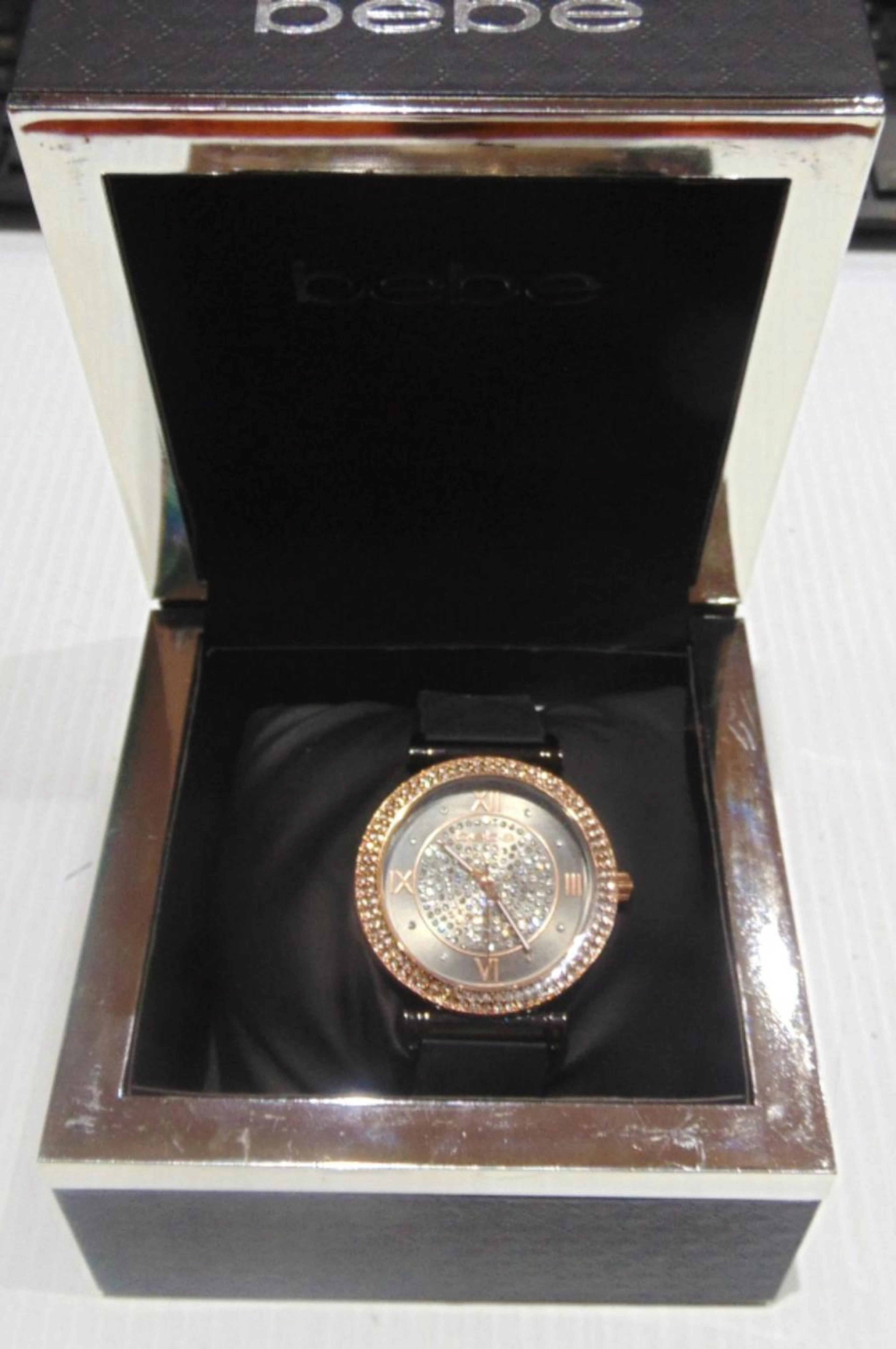 BEBE BLACK AND GOLD CRYSTAL BEZEL WATCH