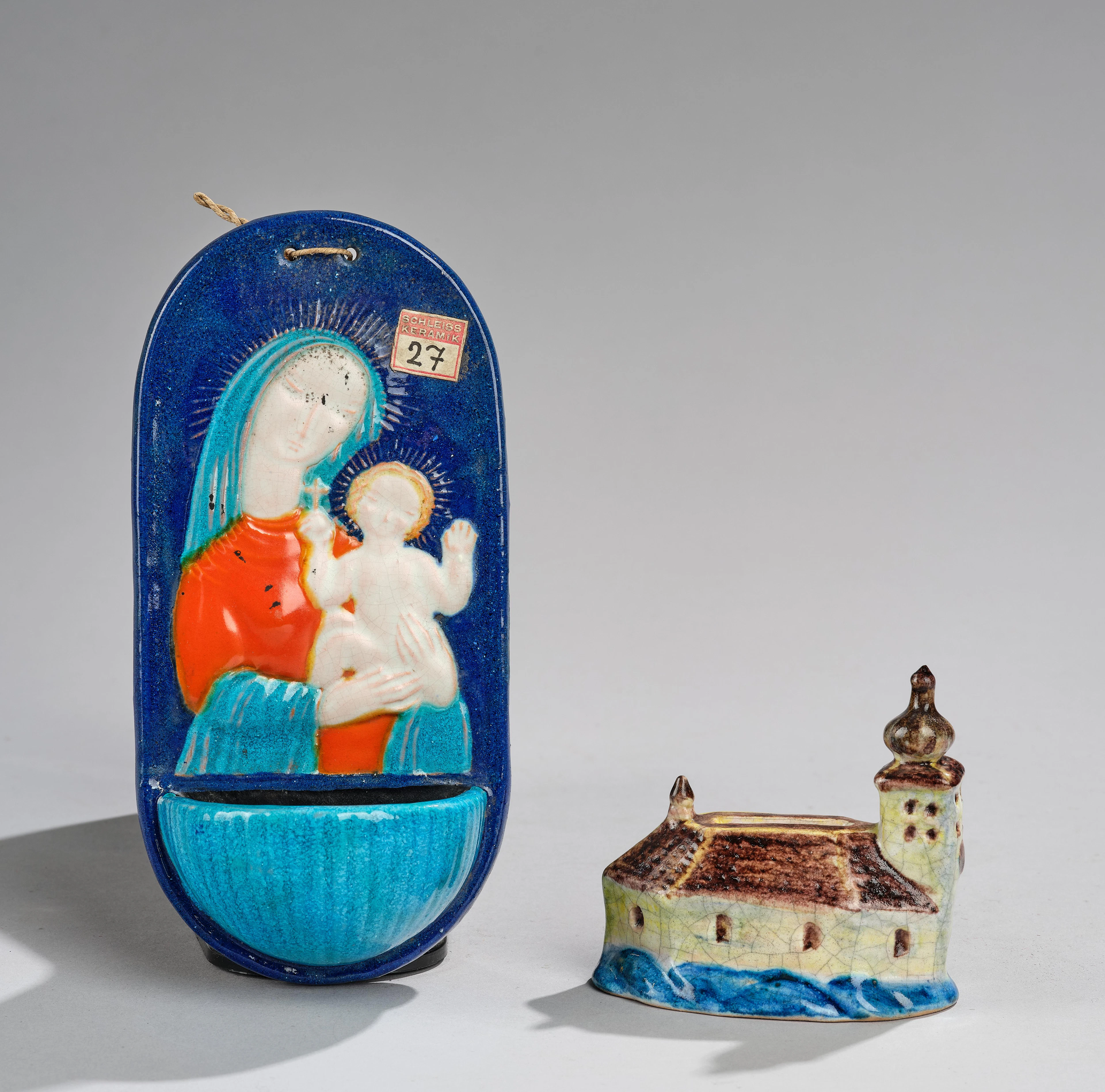 A holy water container and a Schloss Ort money box