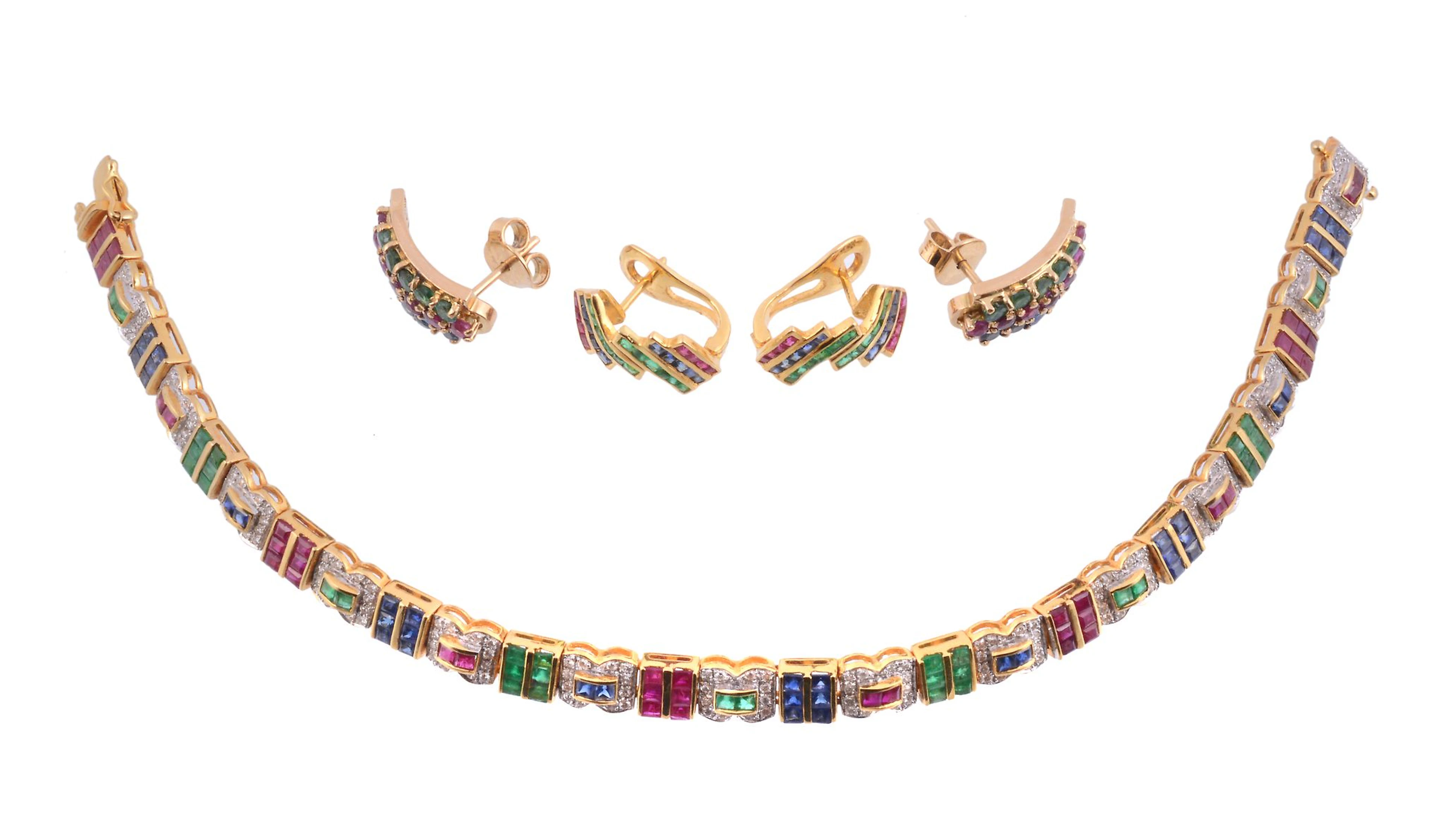 A multi gem bracelet and two pairs of earrings