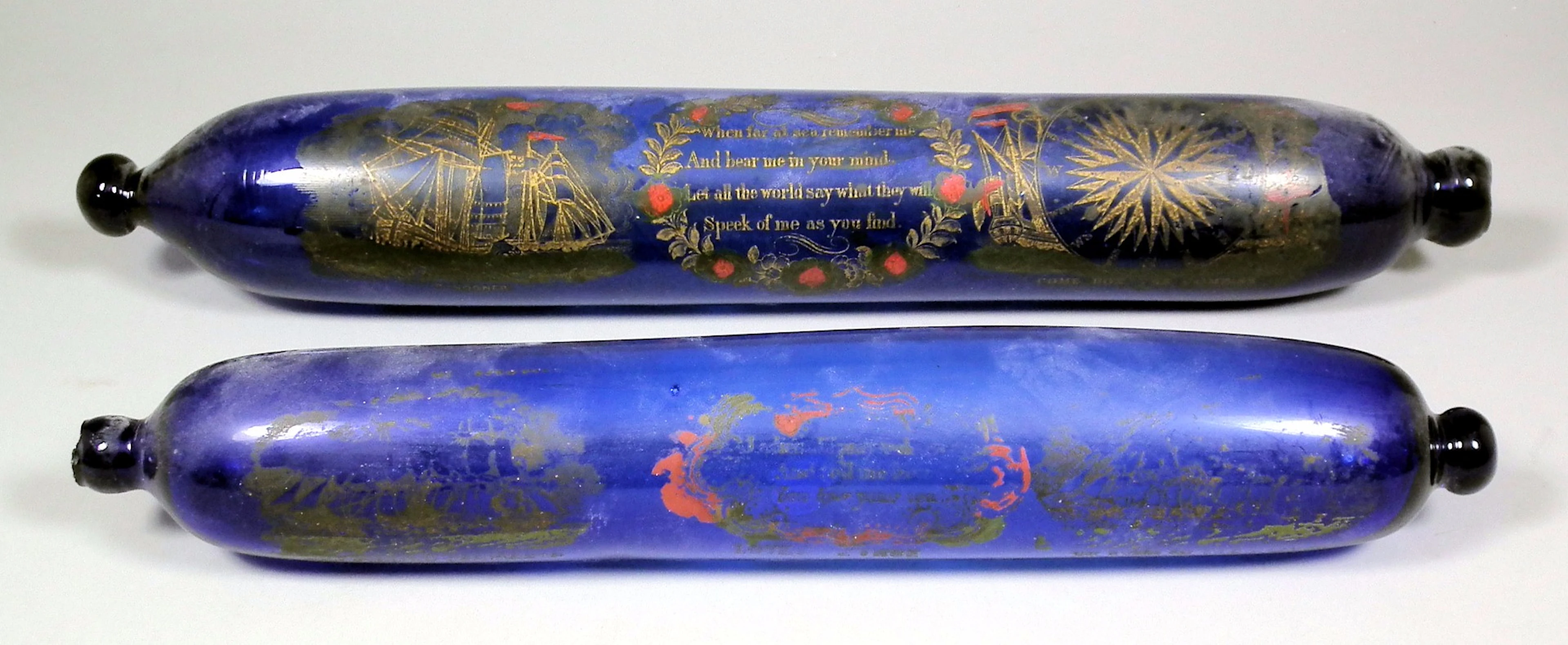 A Victorian "Bristol Blue" rolling pin printed and overpainted...