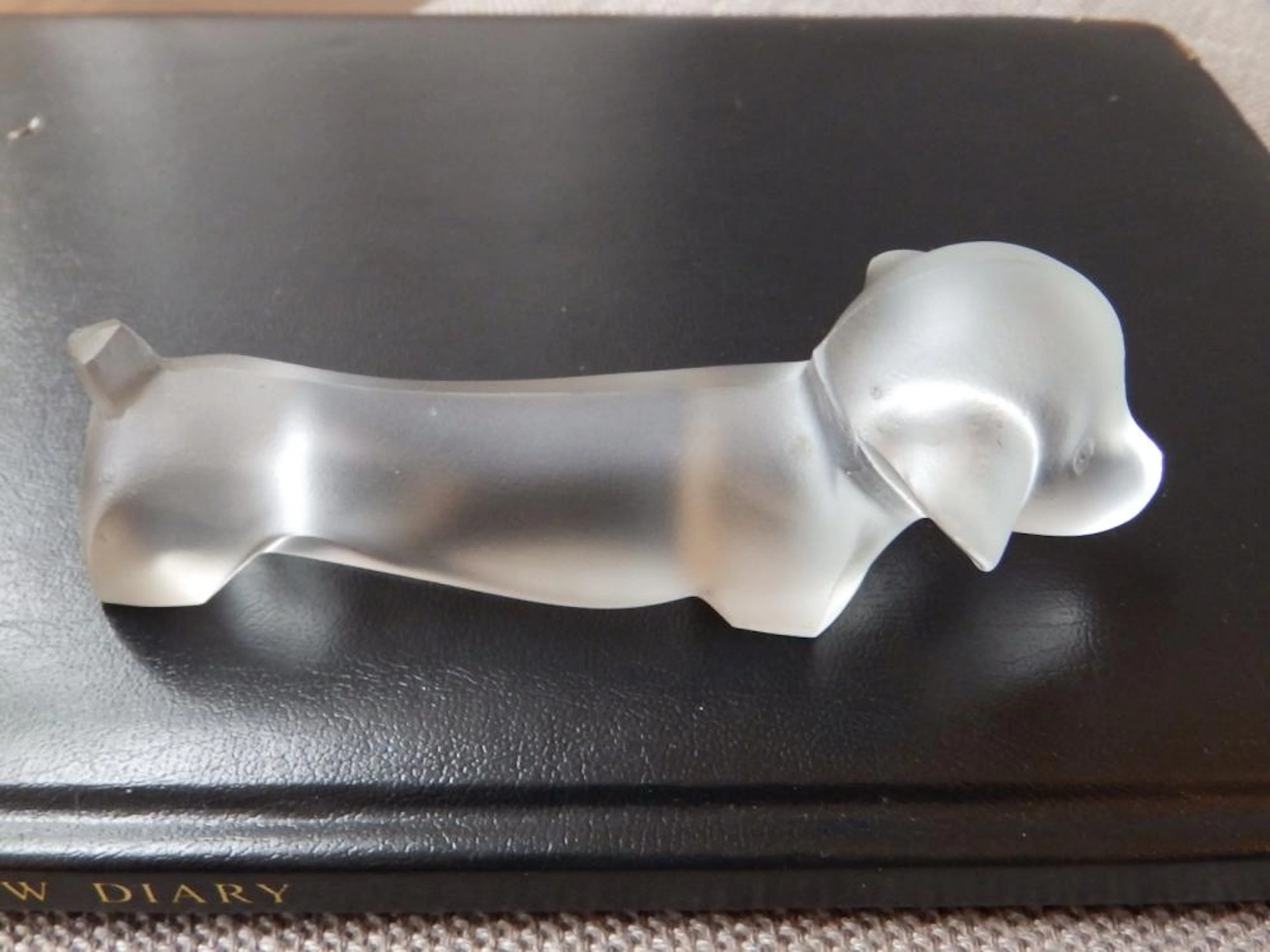 A Royal Leerdam frosted glass daschund paperweight designed by Lucienne Blo