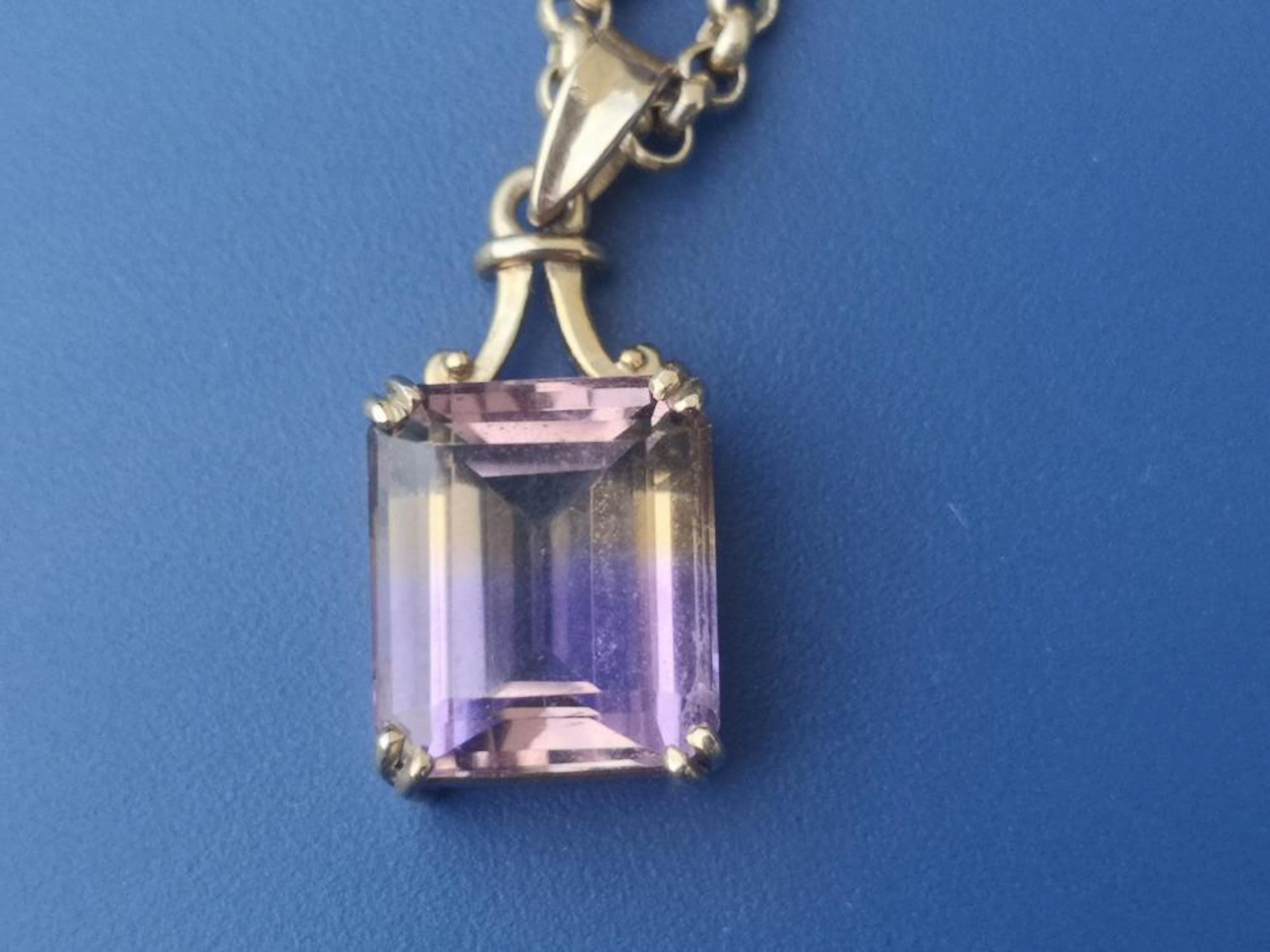 A rectangular ametrine pendant on 9ct necklace chain.