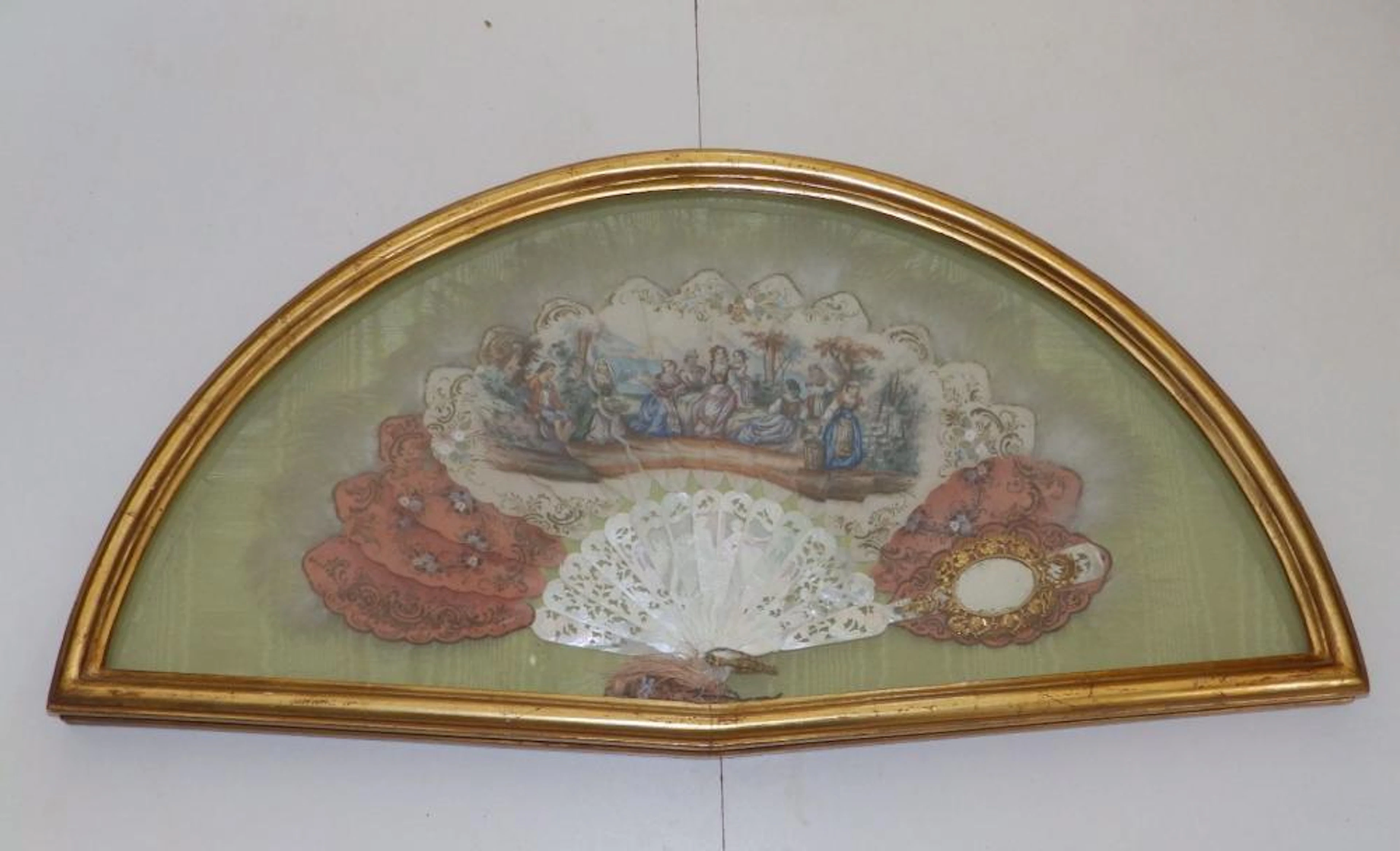 An elaborate 19thC mother-of-pearl fan