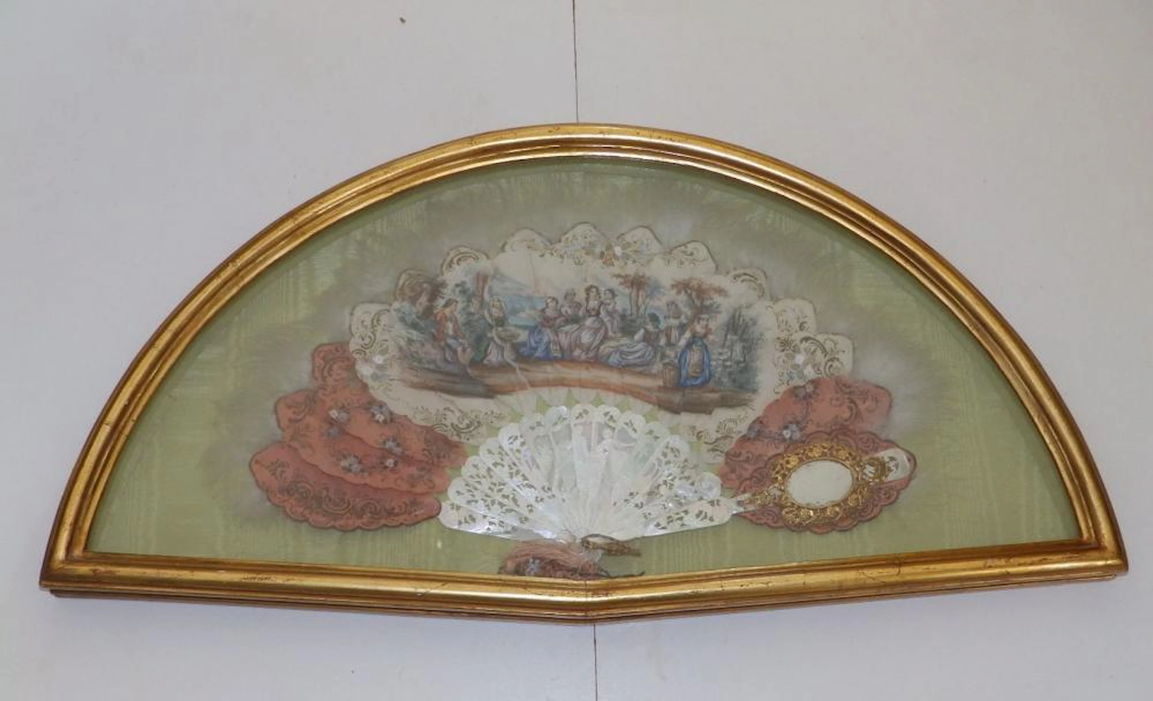An elaborate 19thC mother-of -pearl fan