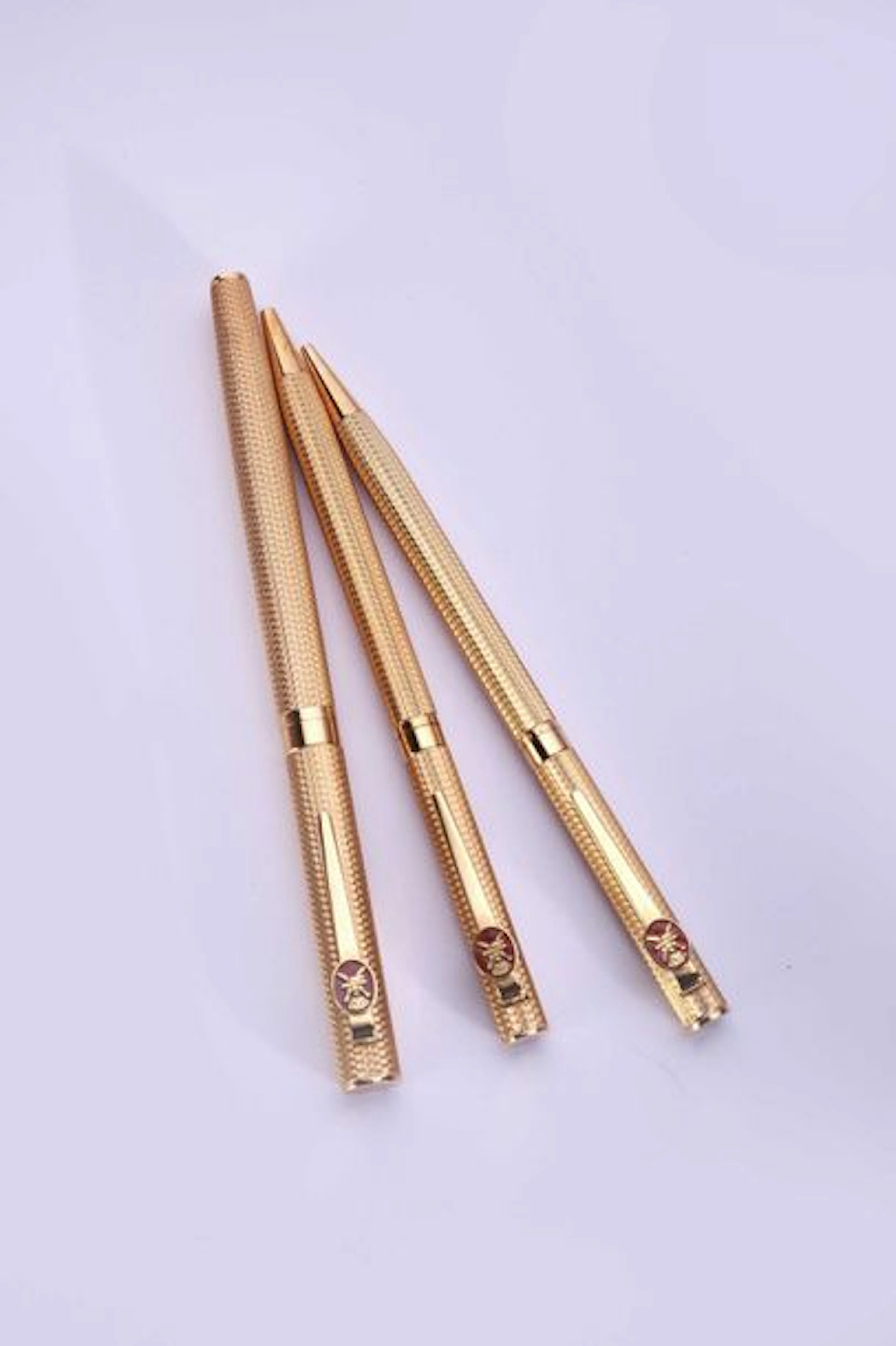 Parure de trois stylos et porte mines en…