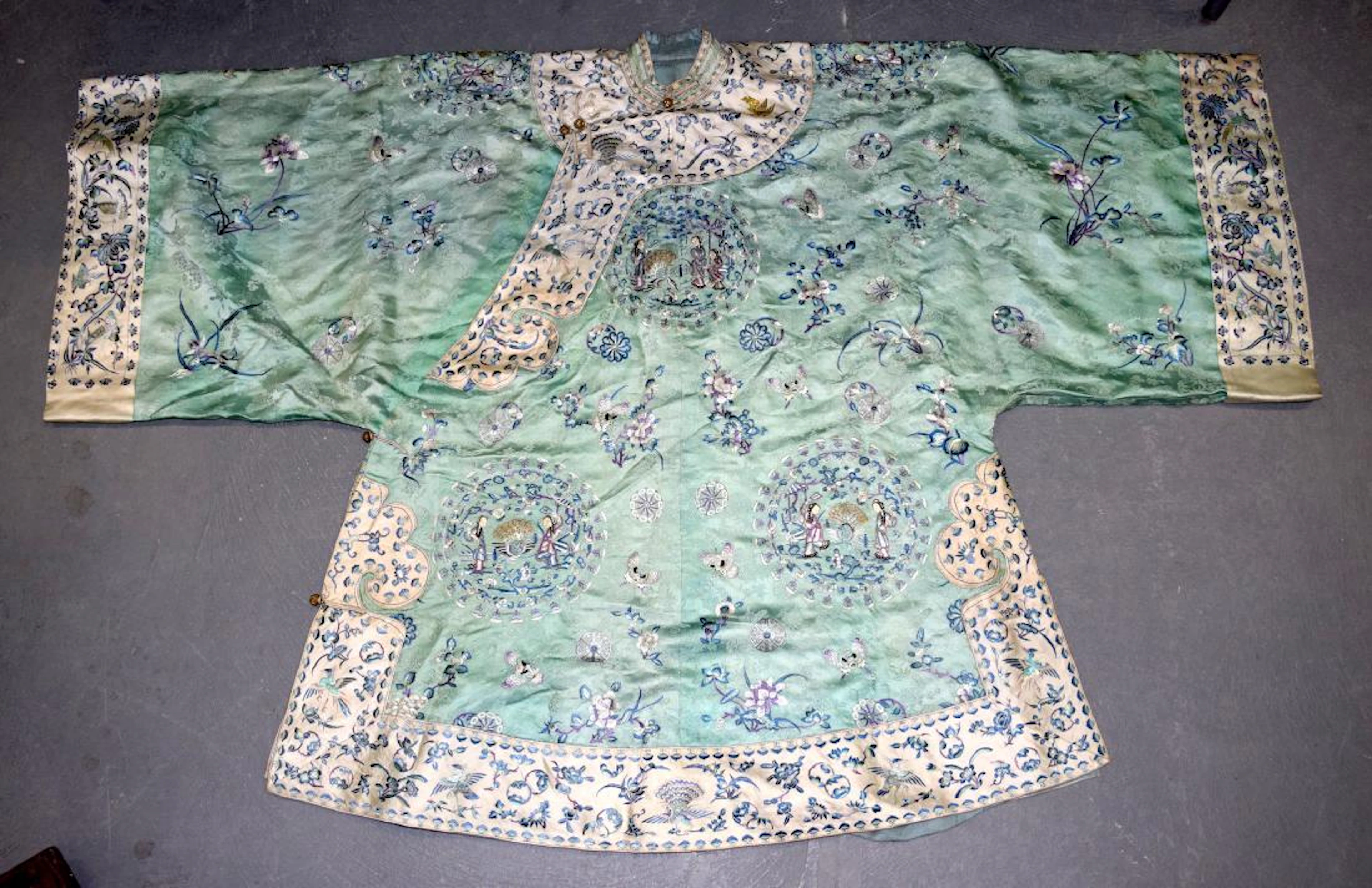 A good late 19th century chinese green silkwork long
